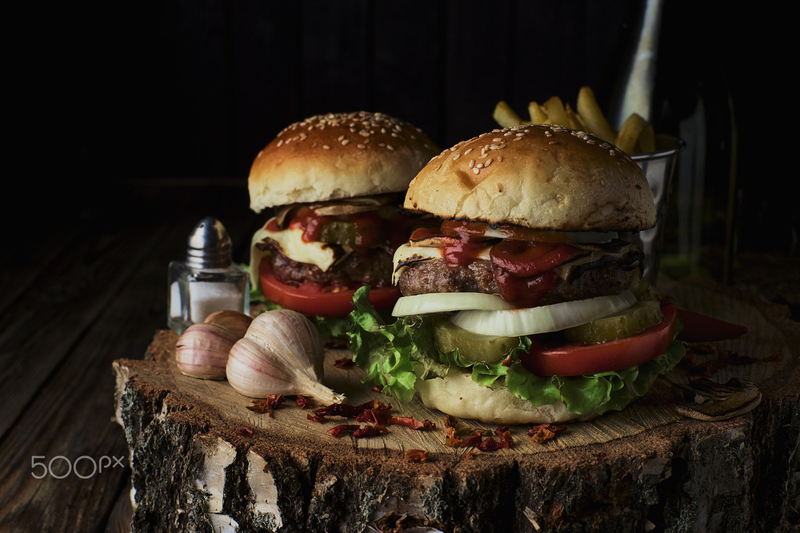 Sony a99 II + Minolta AF 50mm F1.4 [New] sample photo. Two beef burgers on a dark background. photography