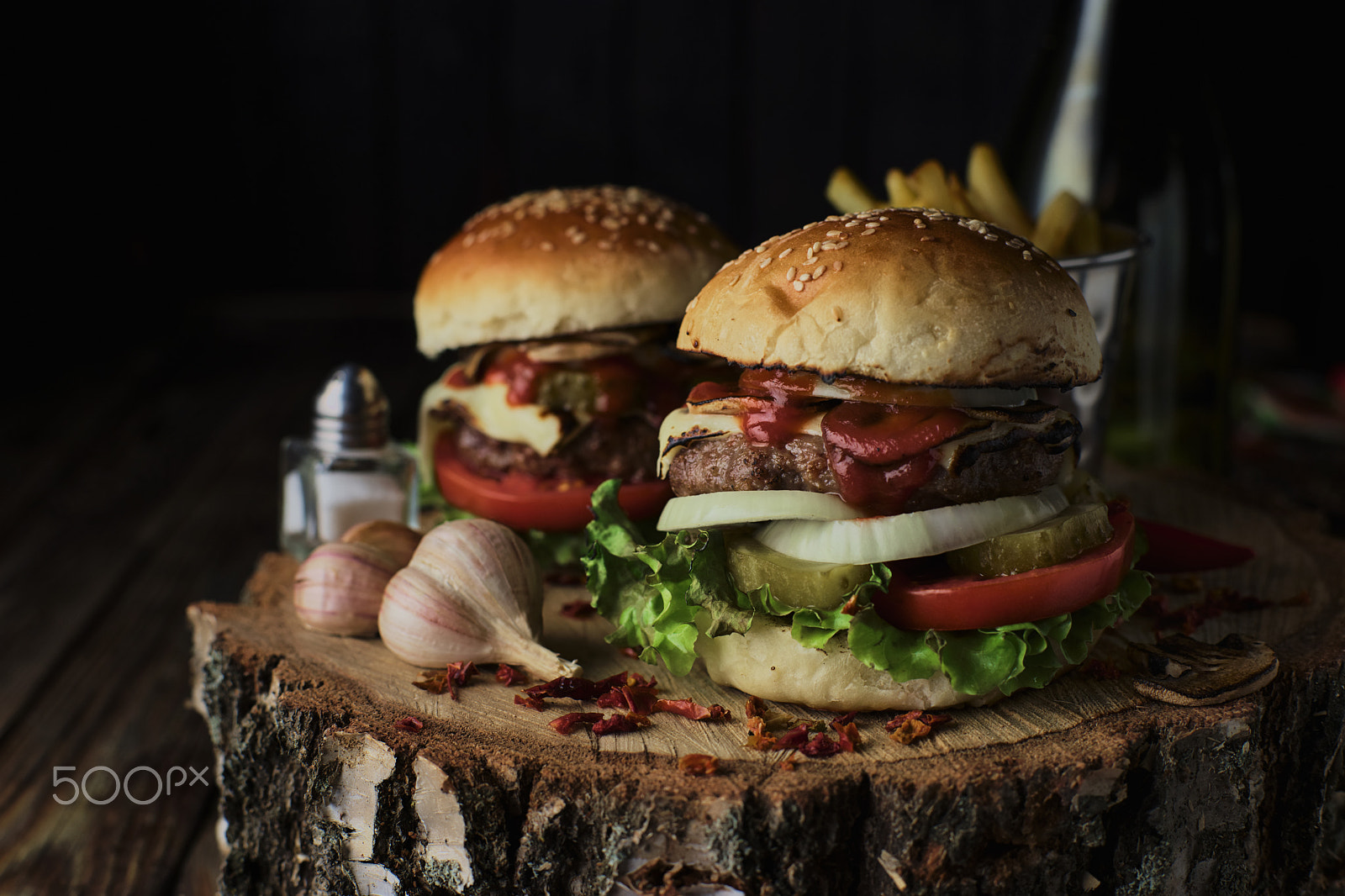 Sony a99 II + Minolta AF 50mm F1.4 [New] sample photo. Two beef burgers on a dark background. photography