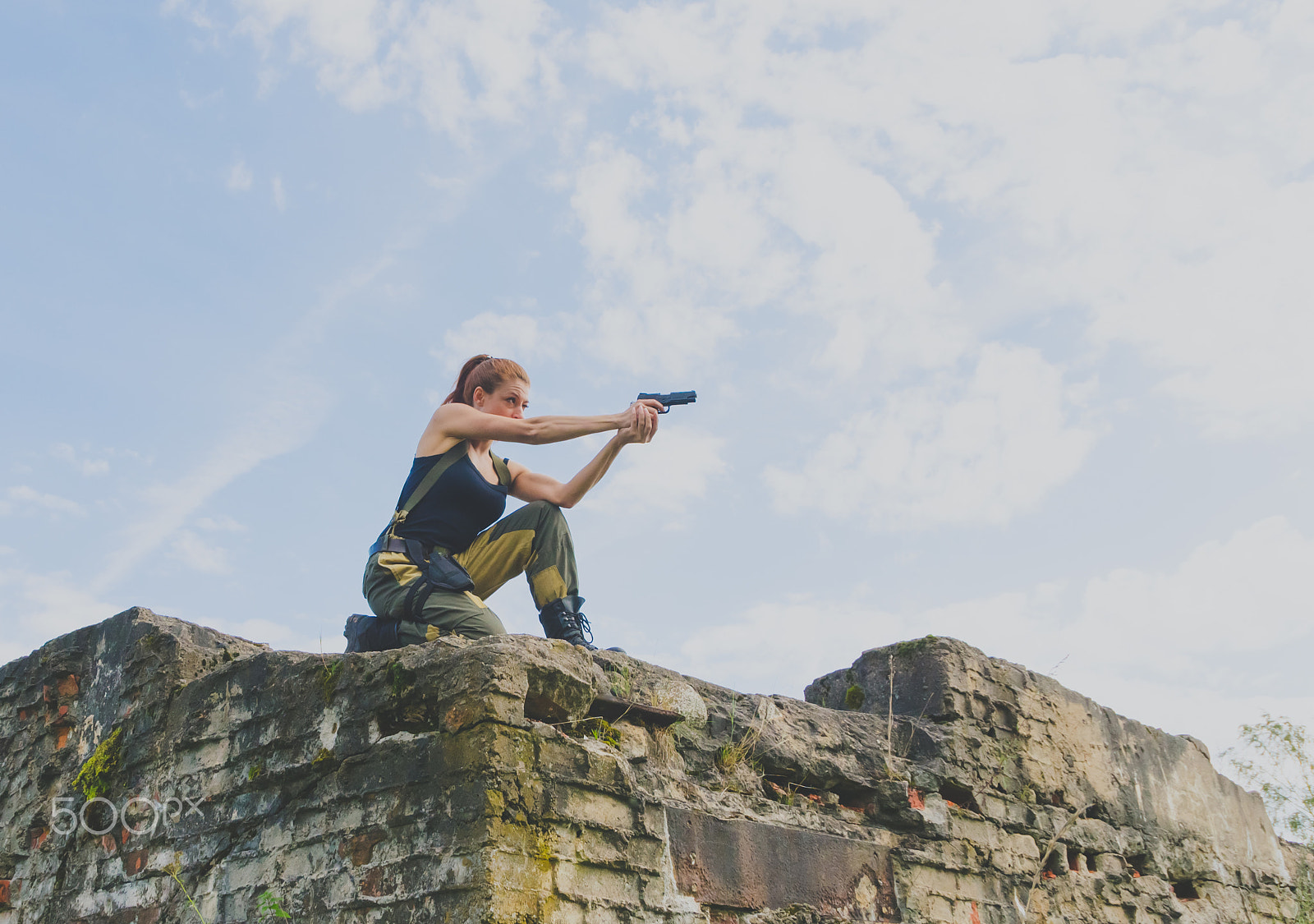 Nikon D7000 + Sigma 18-250mm F3.5-6.3 DC OS HSM sample photo. Redhead girl with a kalashnikov. photography