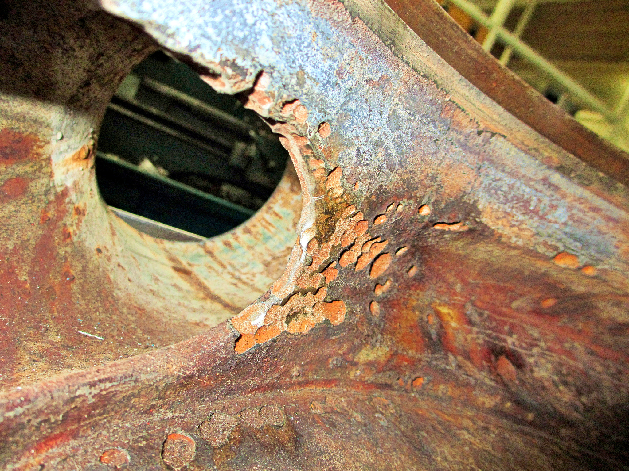 Canon PowerShot ELPH 310 HS (IXUS 230 HS / IXY 600F) sample photo. Pitting corrosion of a pump casing. photography