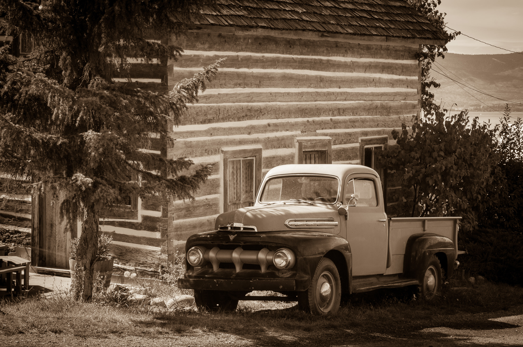 Nikon D300 + Nikon AF-S Nikkor 50mm F1.4G sample photo. Antique truck and log cabin photography