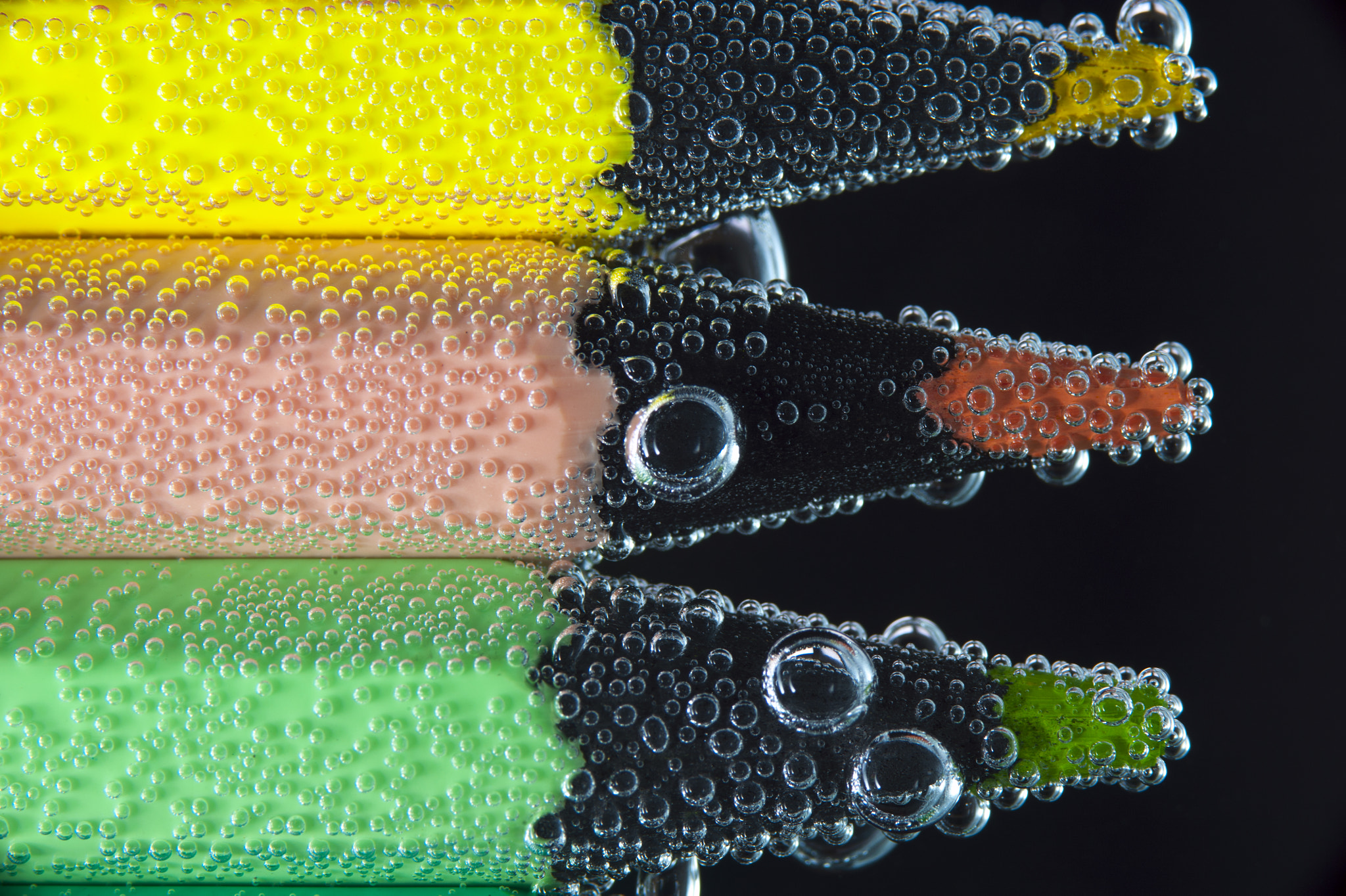 Nikon D700 + AF Micro-Nikkor 105mm f/2.8 sample photo. Closeup colorful pencils in soda water photography