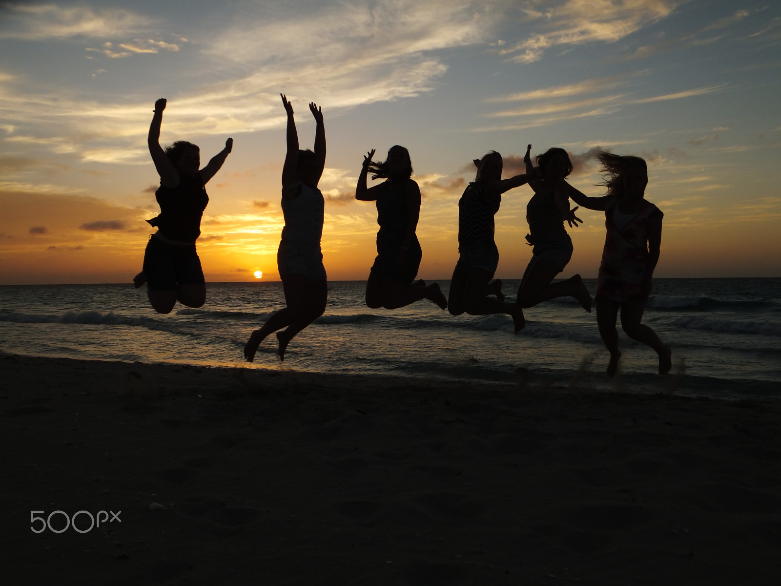 Fujifilm FinePix F550EXR sample photo. Girls jumping at sunset on the beach photography