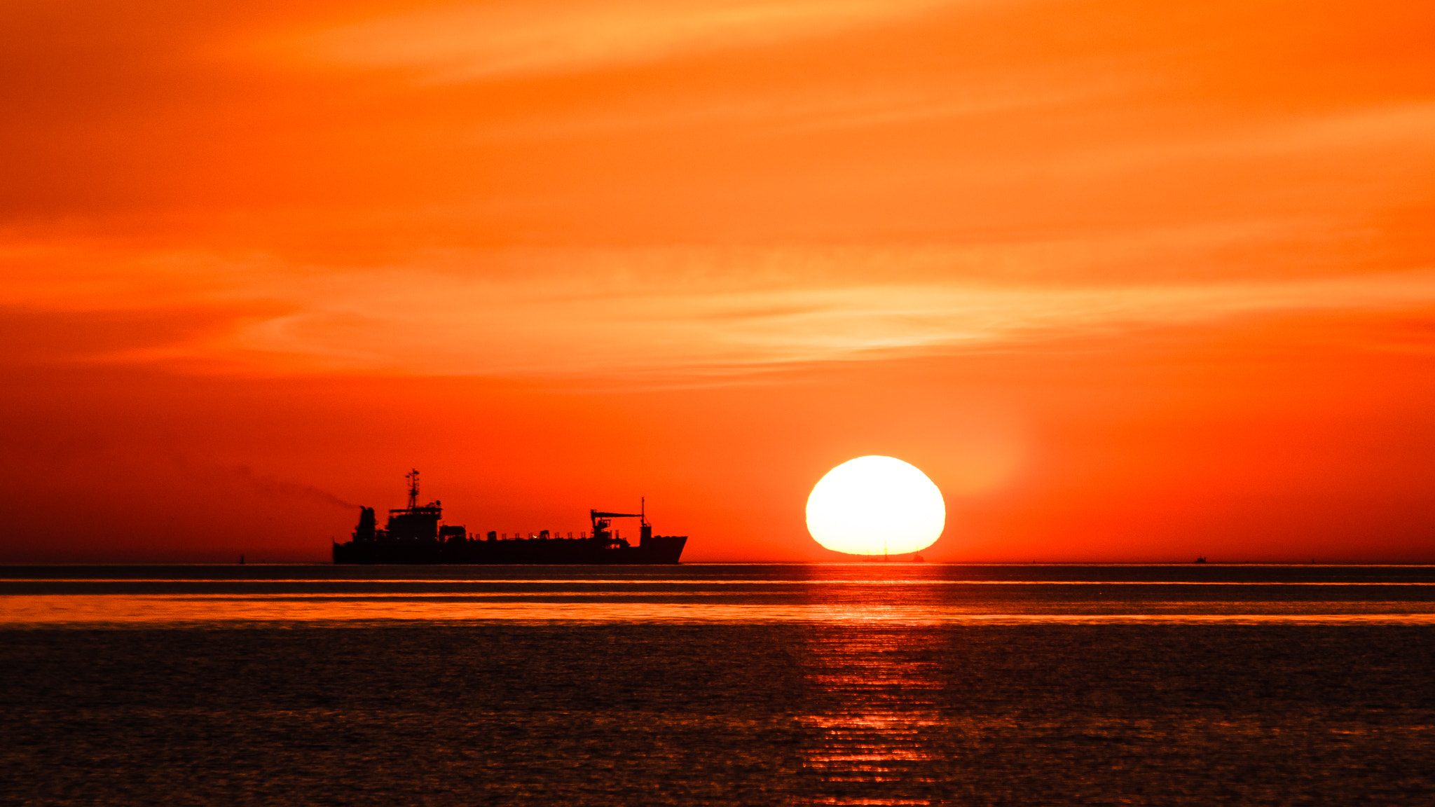 Sigma 70-200mm F2.8 EX DG Macro HSM II sample photo. Shipping boat at sunset photography