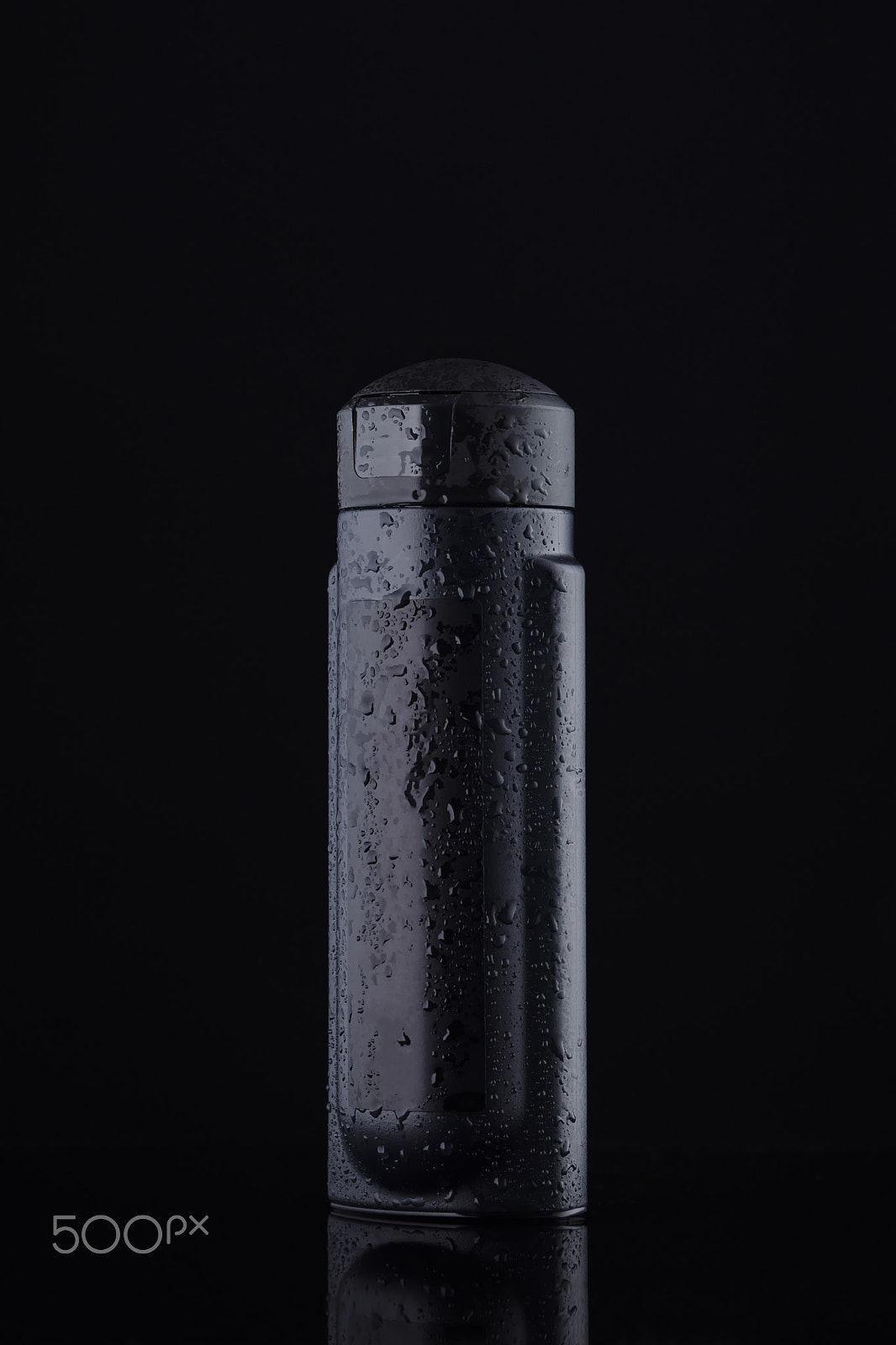 Sony a99 II sample photo. Black capacity for liquids and shampoo on a black background photography