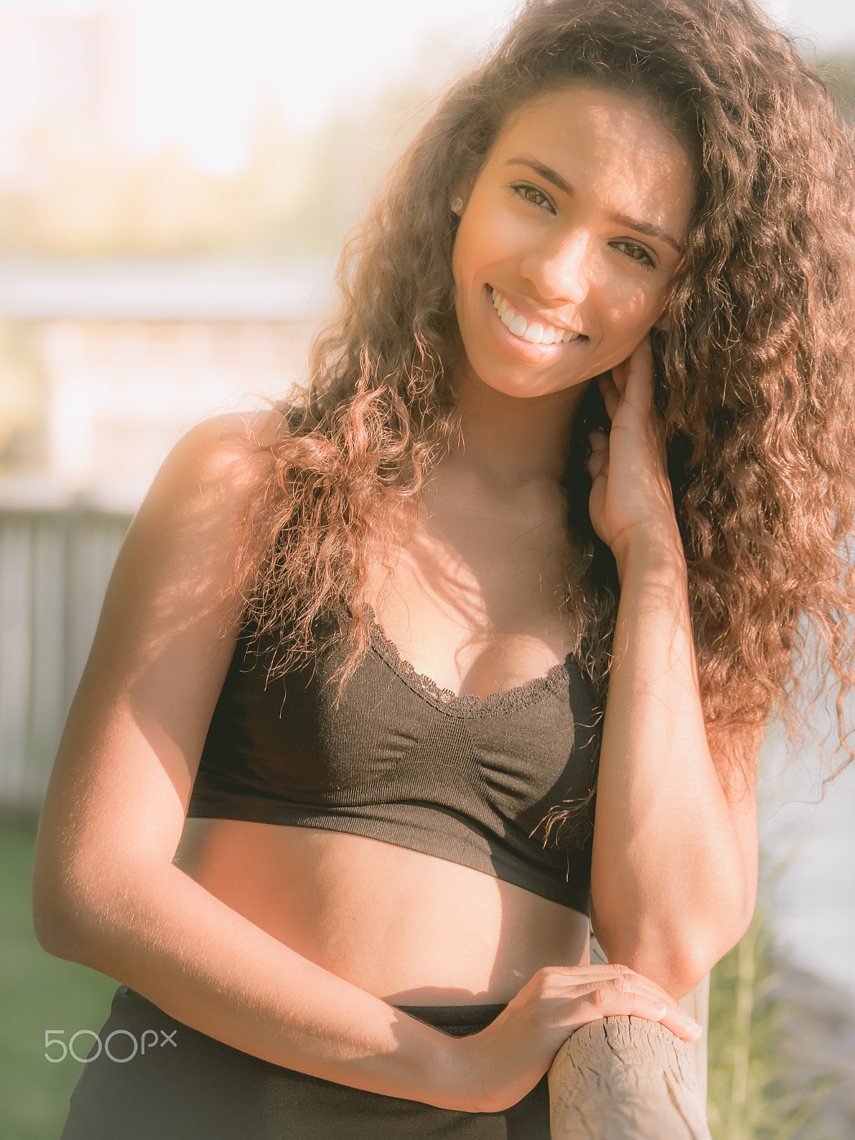 Panasonic Lumix DMC-GH3 sample photo. Young latina woman smiling sweetly photography