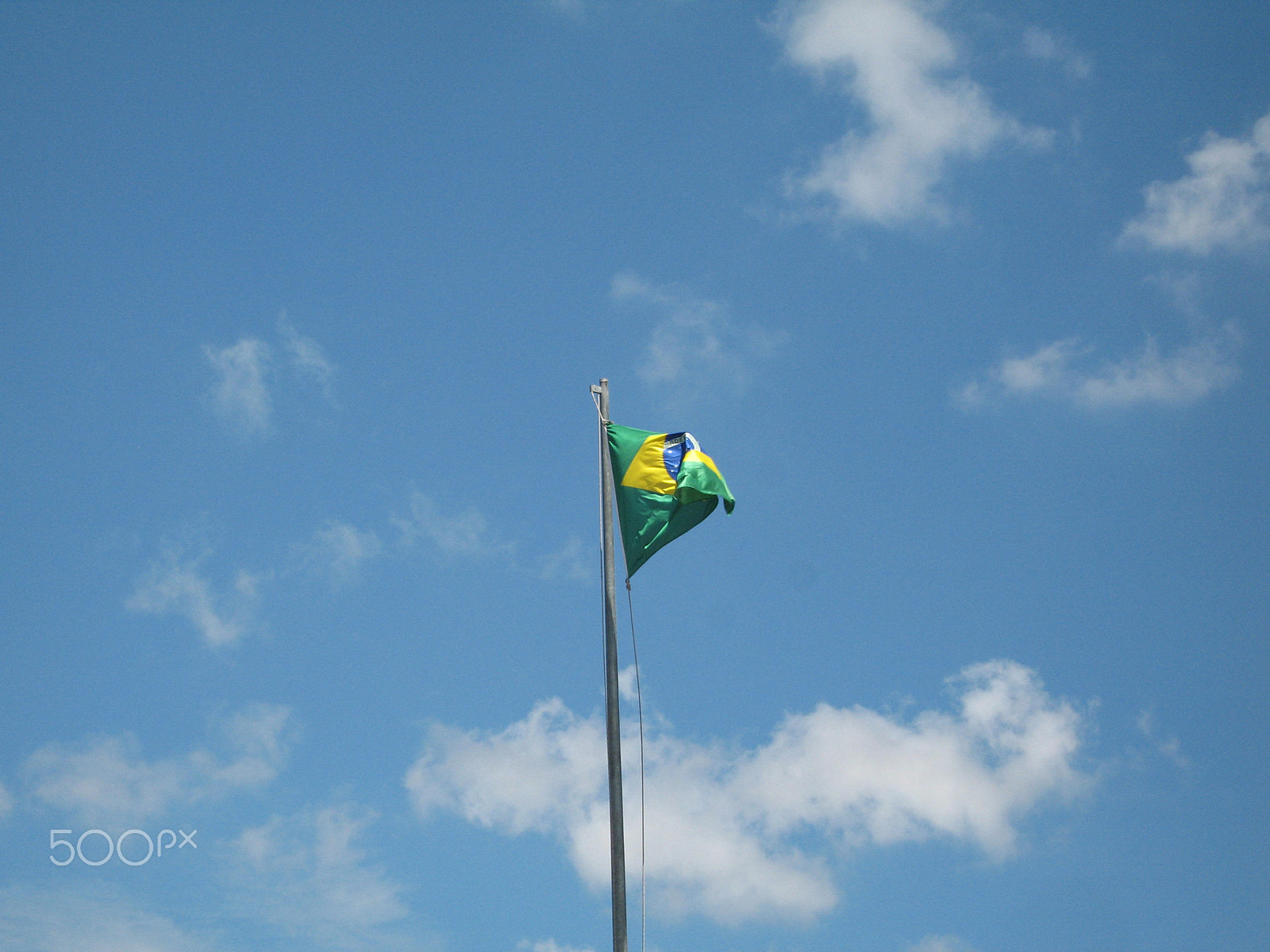 Canon IXY DIGITAL 700 sample photo. Flag in sky photography