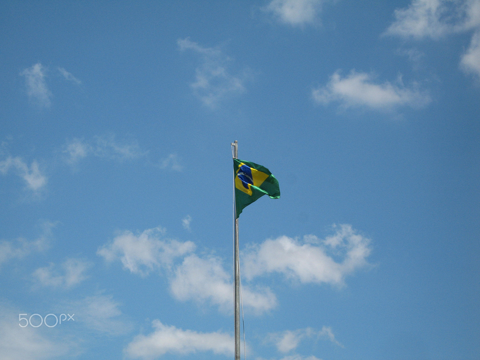 Canon IXY DIGITAL 700 sample photo. Flag in sky photography