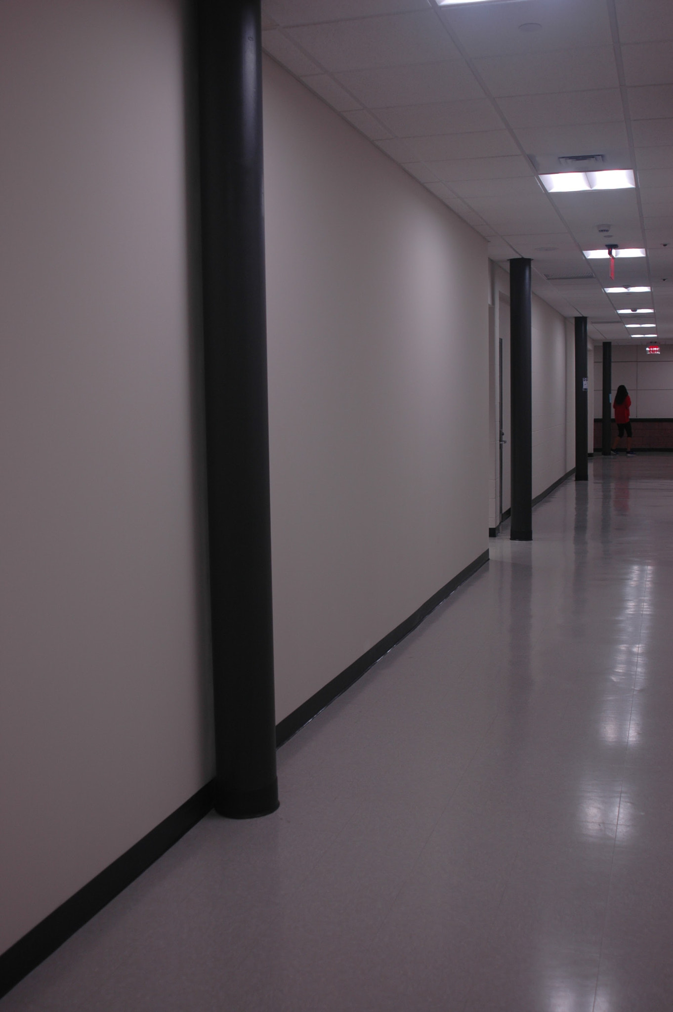 Nikon D70s sample photo. Lighted hallway with pillars photography