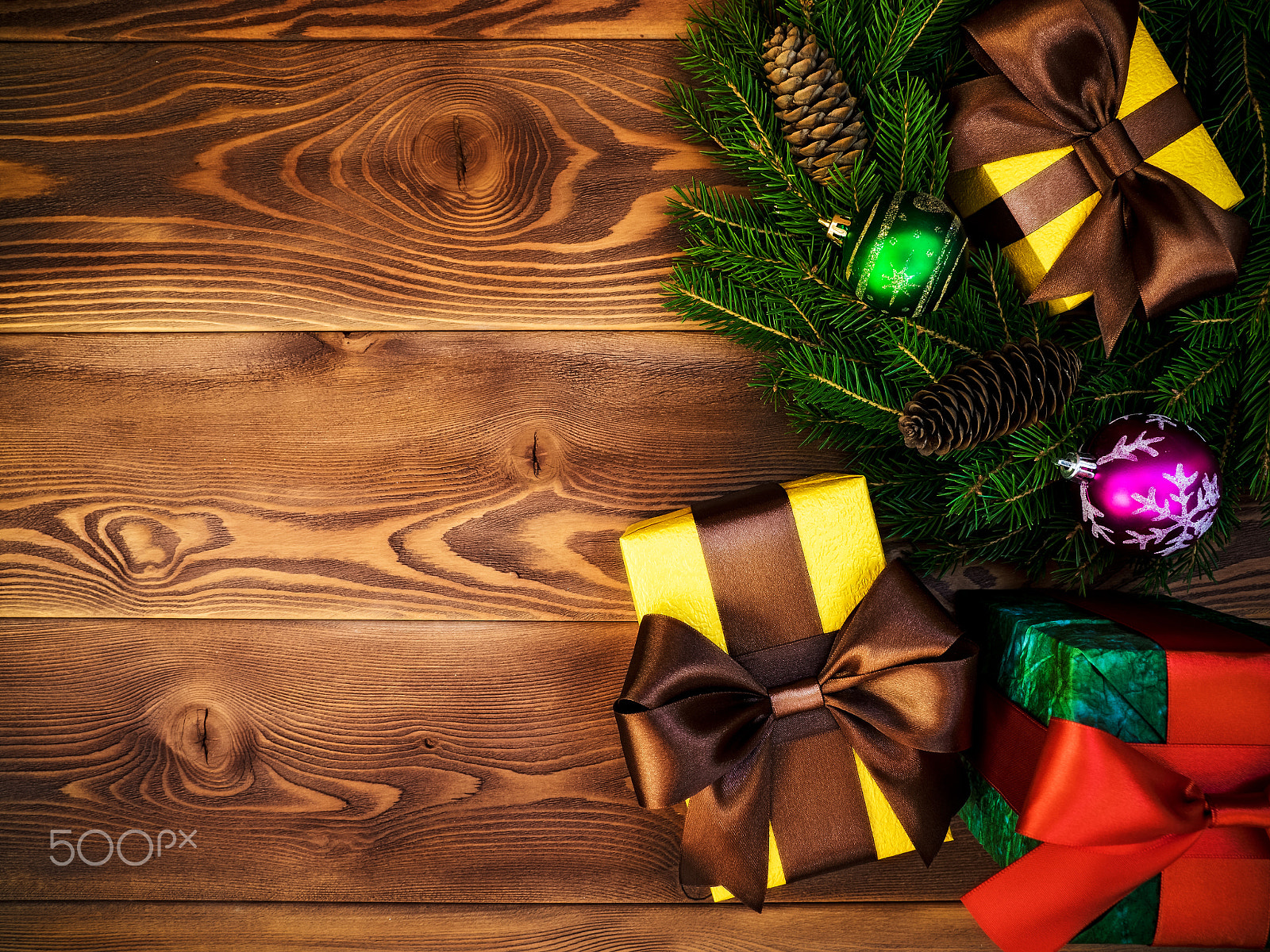 Olympus OM-D E-M1 sample photo. Wreath on the wooden board. wrapped gift boxes. christmas and new year concept photography