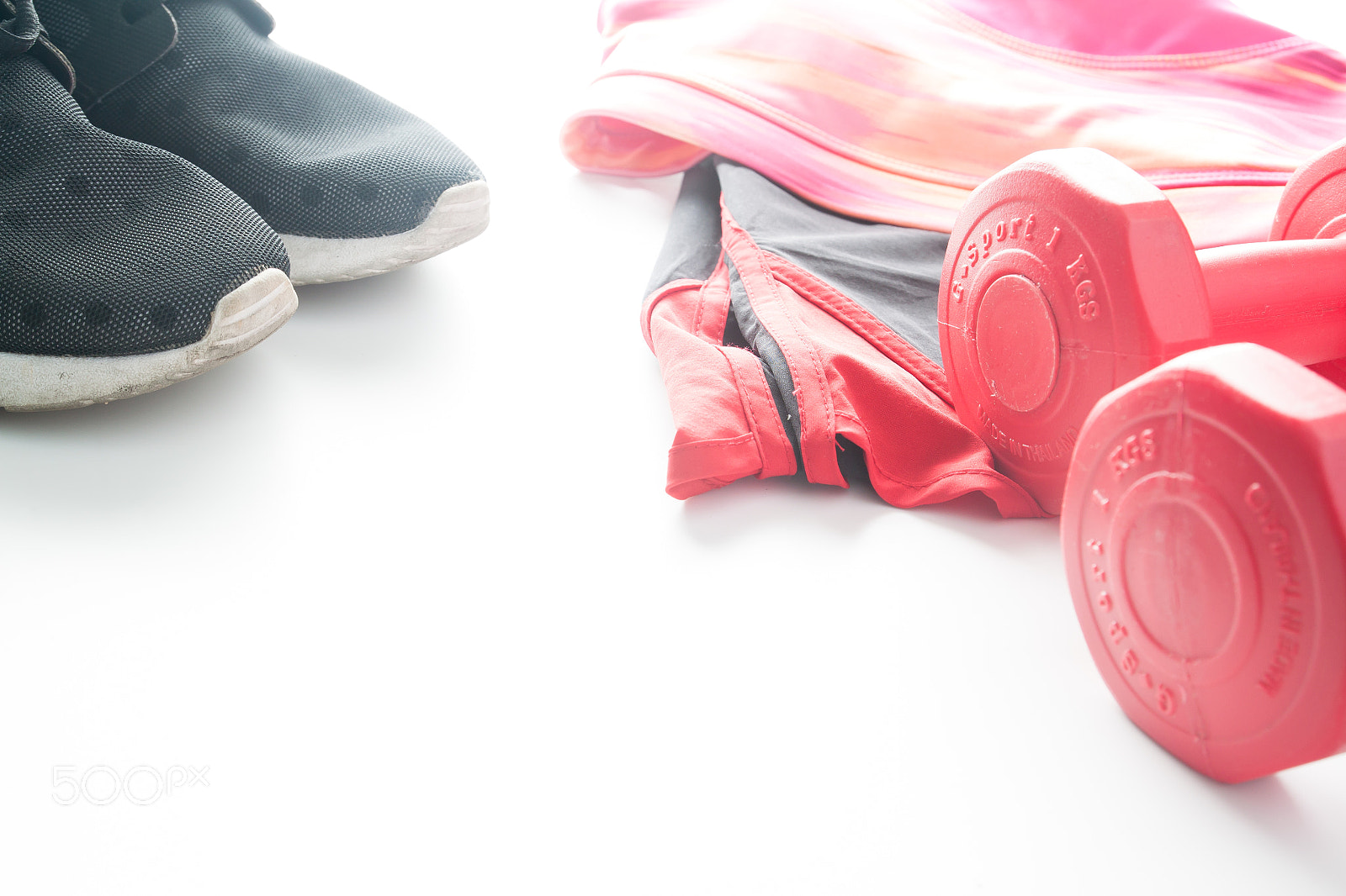 Canon EOS 500D (EOS Rebel T1i / EOS Kiss X3) sample photo. Red dumbbells and sport wear in fittness background. sport wear photography