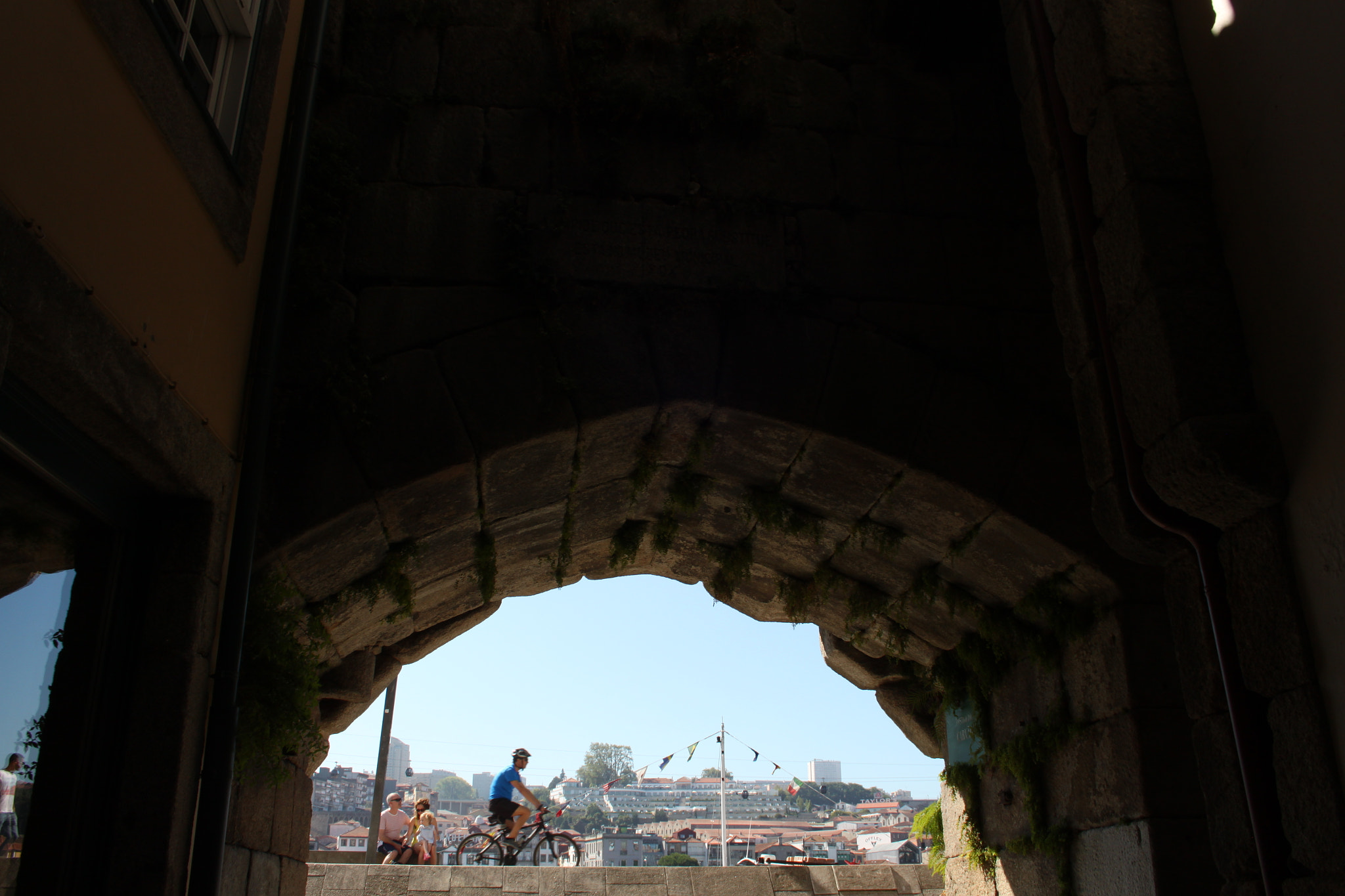 Canon EF-S 18-55mm F3.5-5.6 II sample photo. Biker through the hole photography