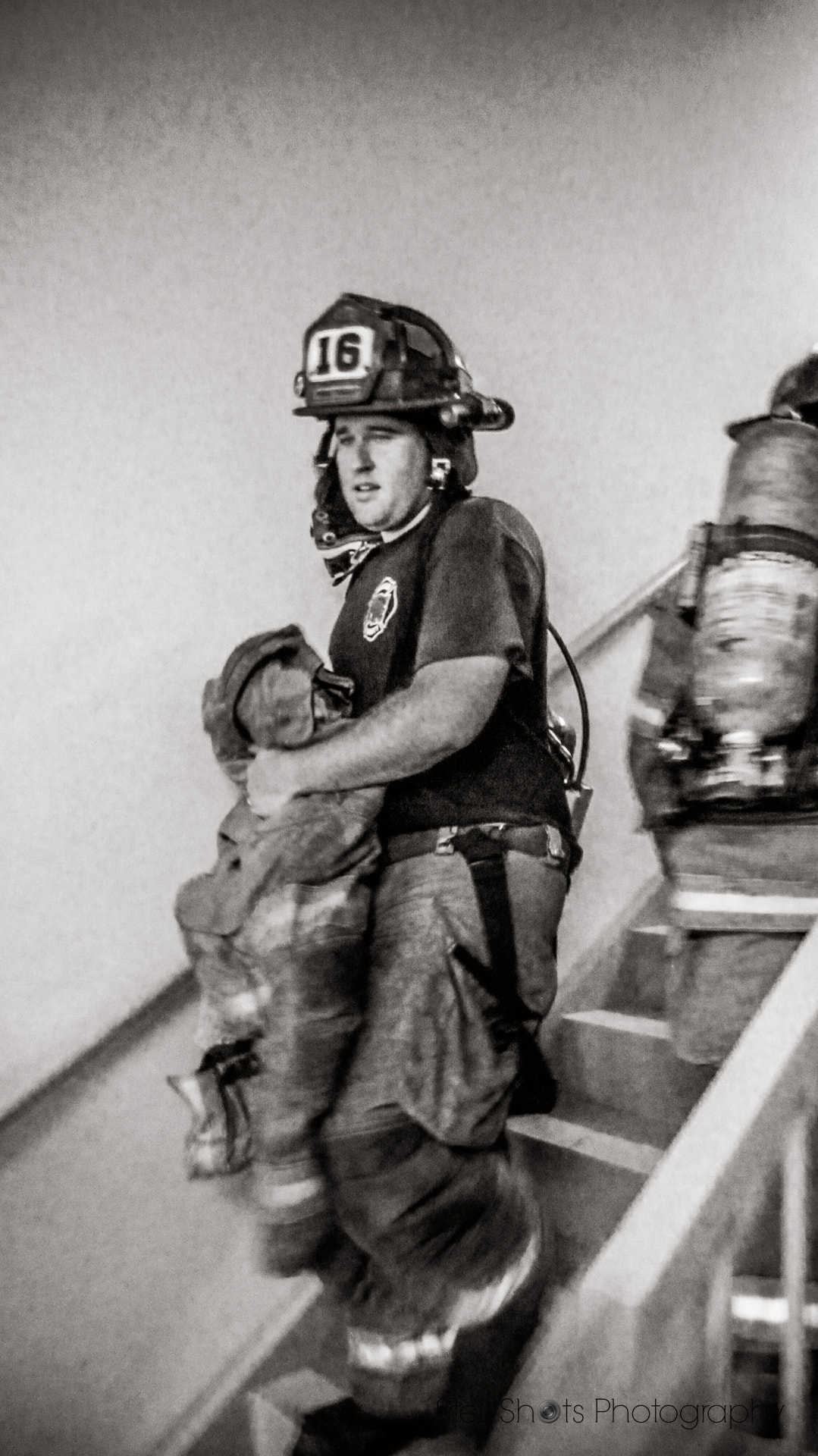 Canon PowerShot ELPH 300 HS (IXUS 220 HS / IXY 410F) sample photo. Firefighter on the stairwell photography