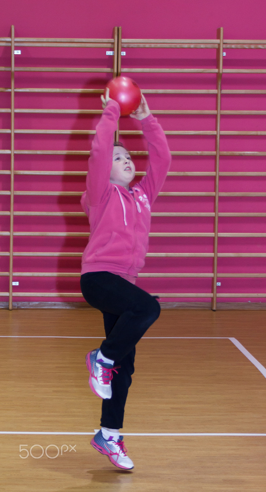 Canon EF 75-300mm F4.0-5.6 IS USM sample photo. Girl throws a red ball in the basket at the sports hall photography