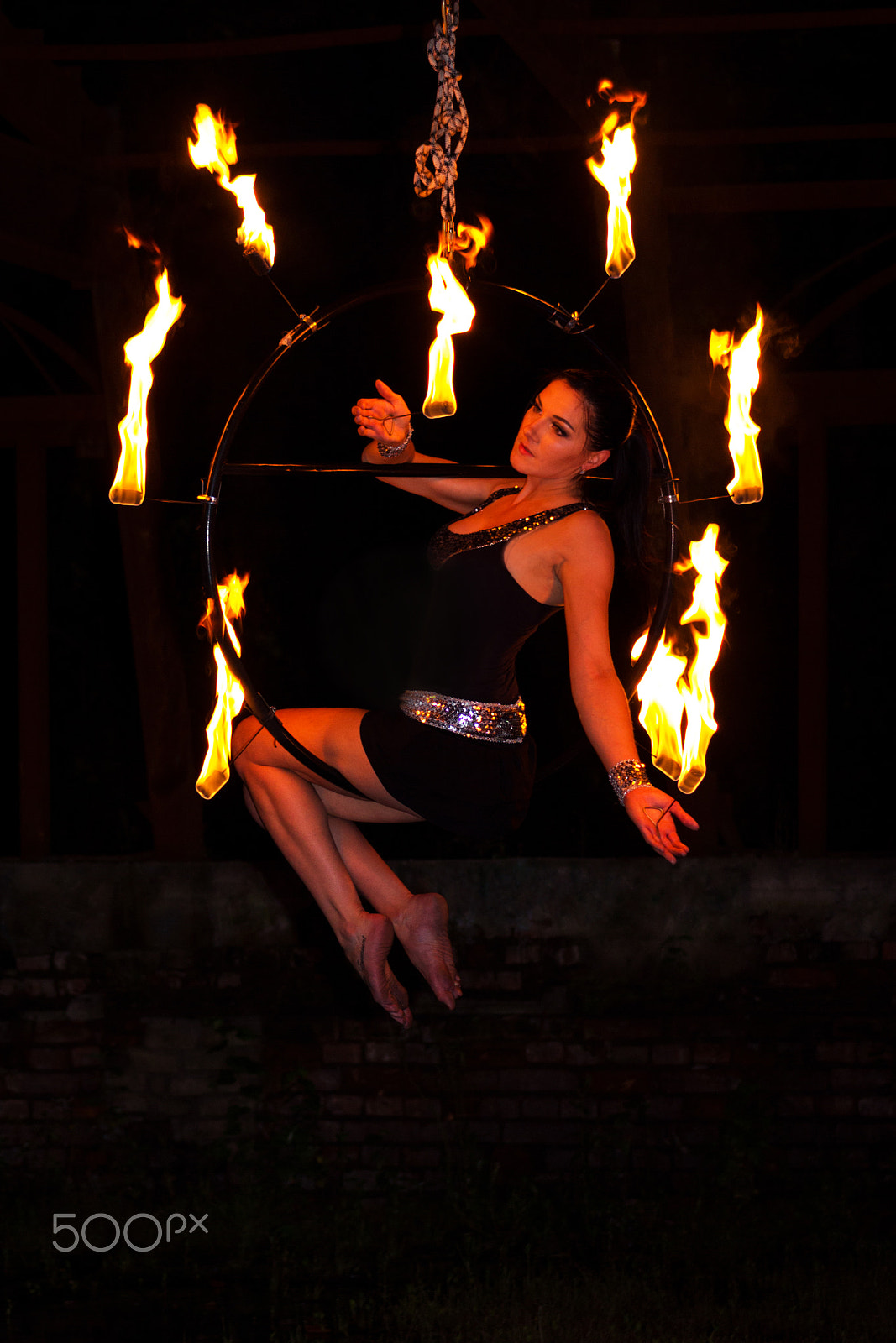 Canon EF 75-300mm f/4-5.6 USM sample photo. Aerialist on ring with palm torches photography