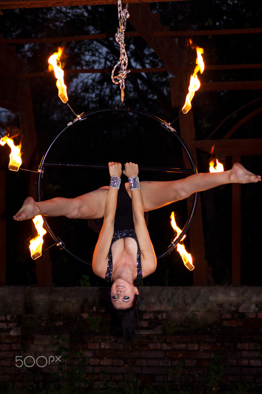 Canon EF 75-300mm f/4-5.6 USM sample photo. Aerialist on ring with palm torches photography