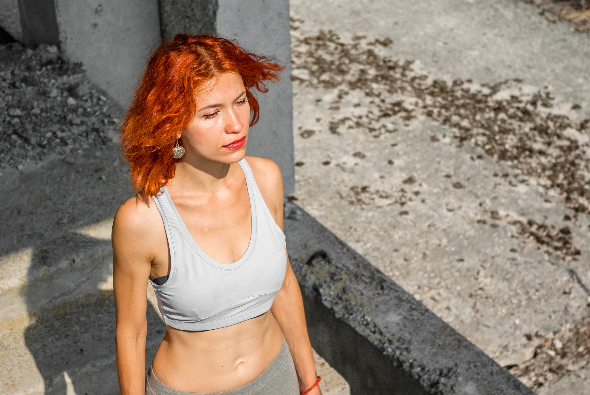 Pentax K200D sample photo. Fitness girl on the old stairs in an abandoned factory photography