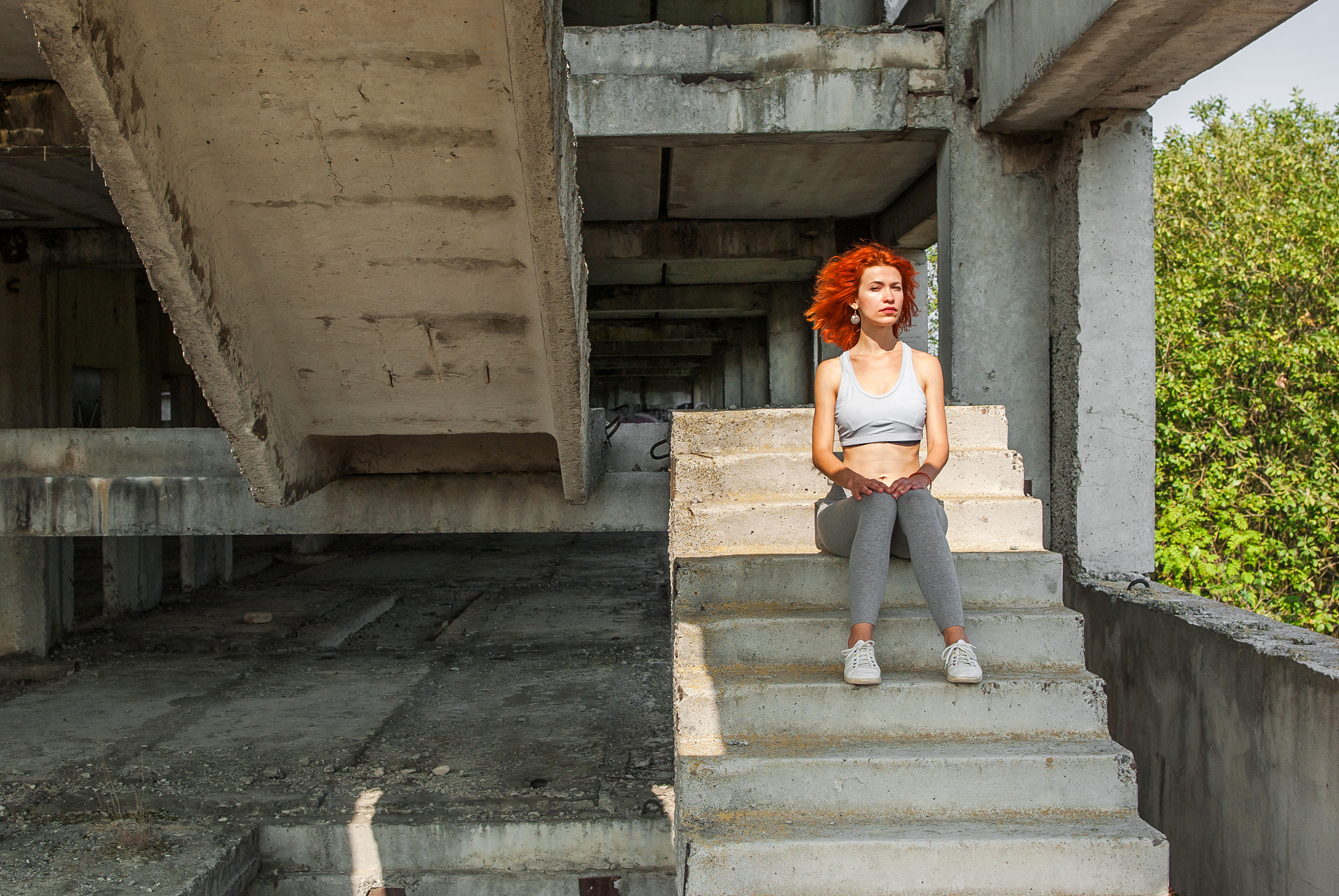 Pentax K200D sample photo. Fitness girl on the old stairs in an abandoned factory photography