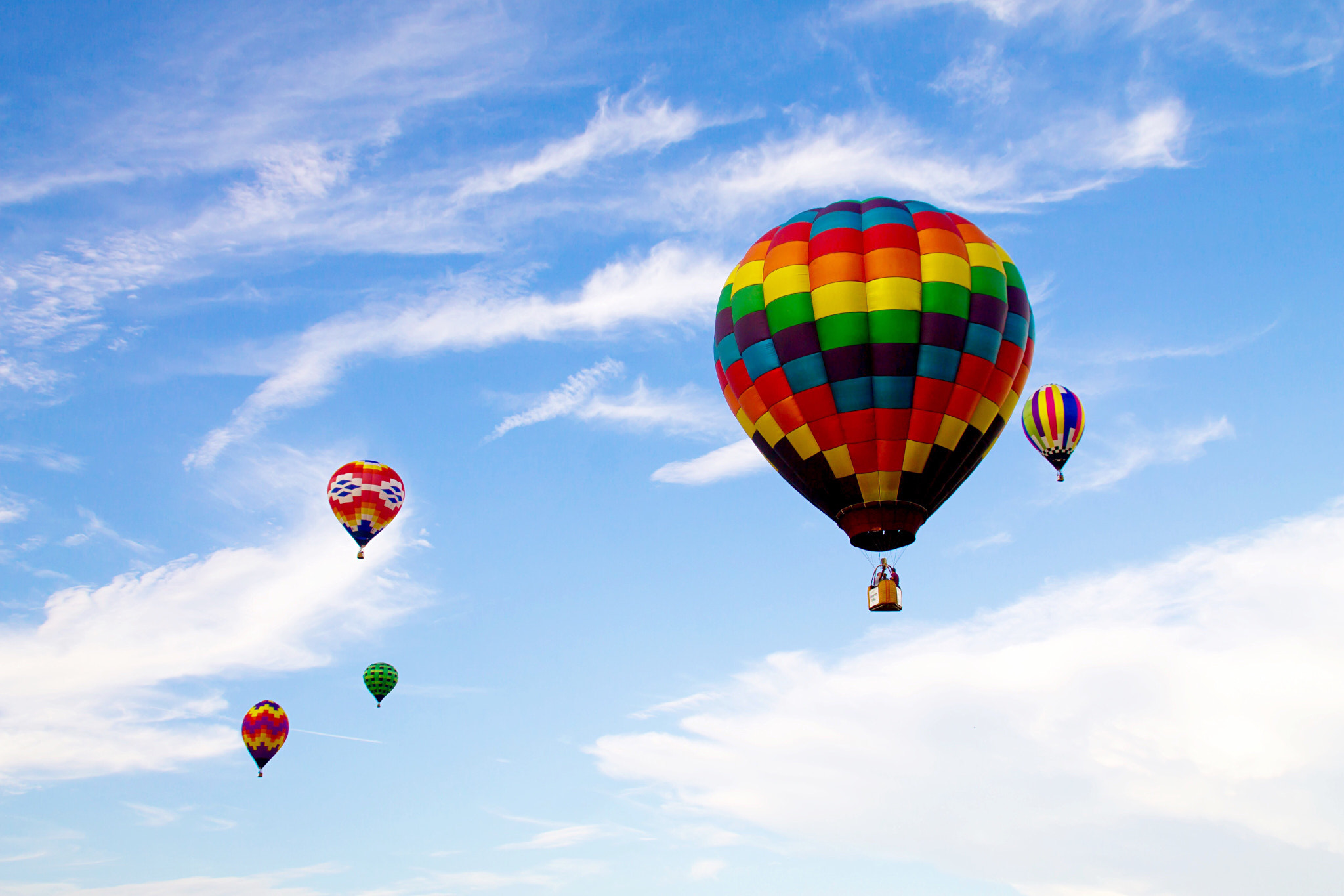 Canon EOS 1100D (EOS Rebel T3 / EOS Kiss X50) sample photo. Hot air balloons floating through a blue sky photography