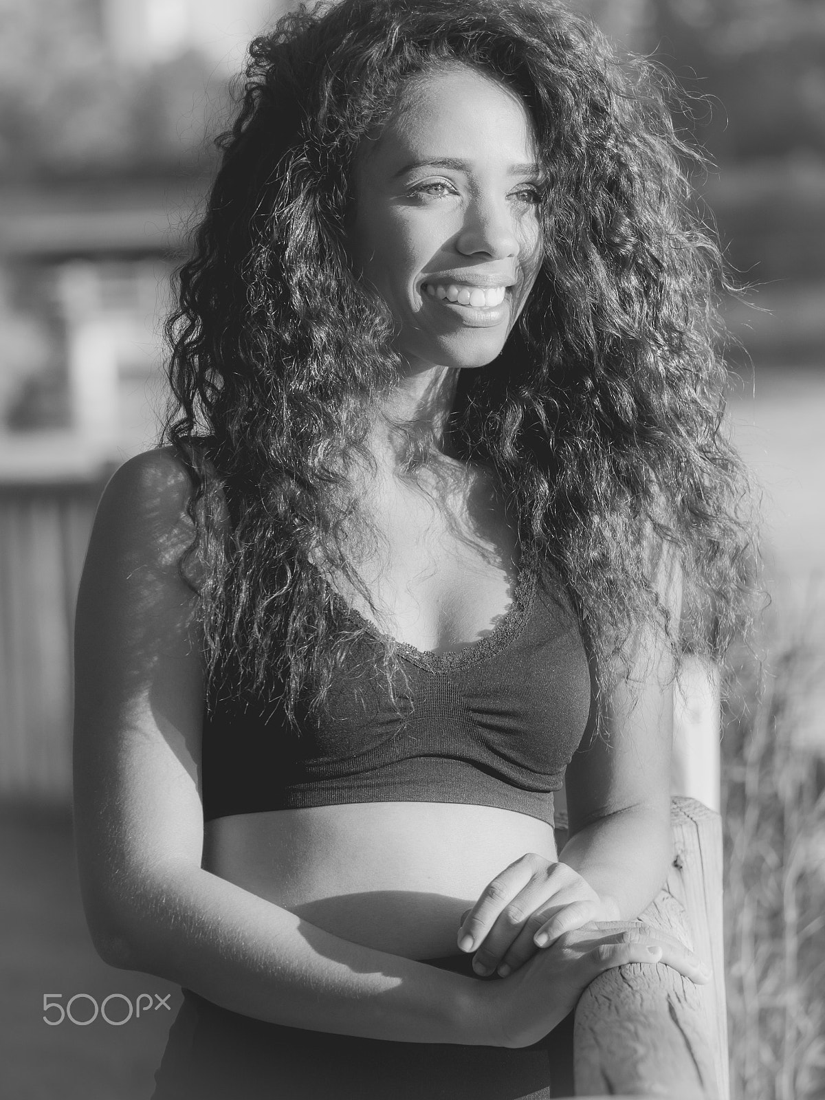 Panasonic Lumix DMC-GH3 sample photo. Young latina woman dressed in black laughing outdoor sunset, mon photography