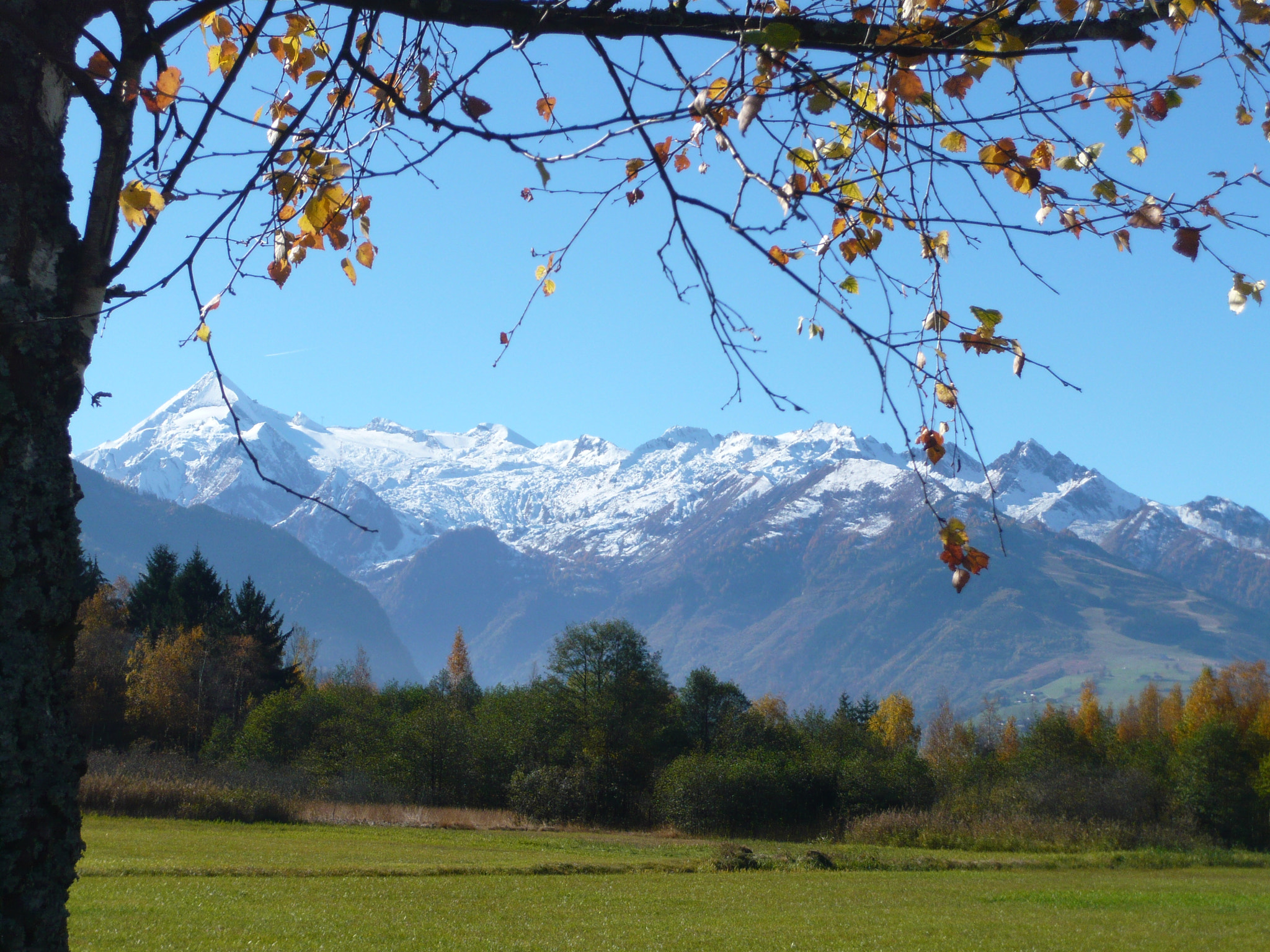 Panasonic DMC-FX33 sample photo. Framed snow covered mountains photography