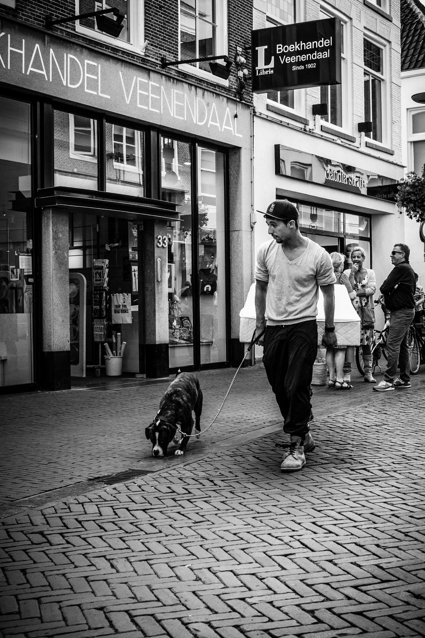 Canon EOS 500D (EOS Rebel T1i / EOS Kiss X3) + Canon EF-S 24mm F2.8 STM sample photo. A man and his dog ~ amersfoort photography