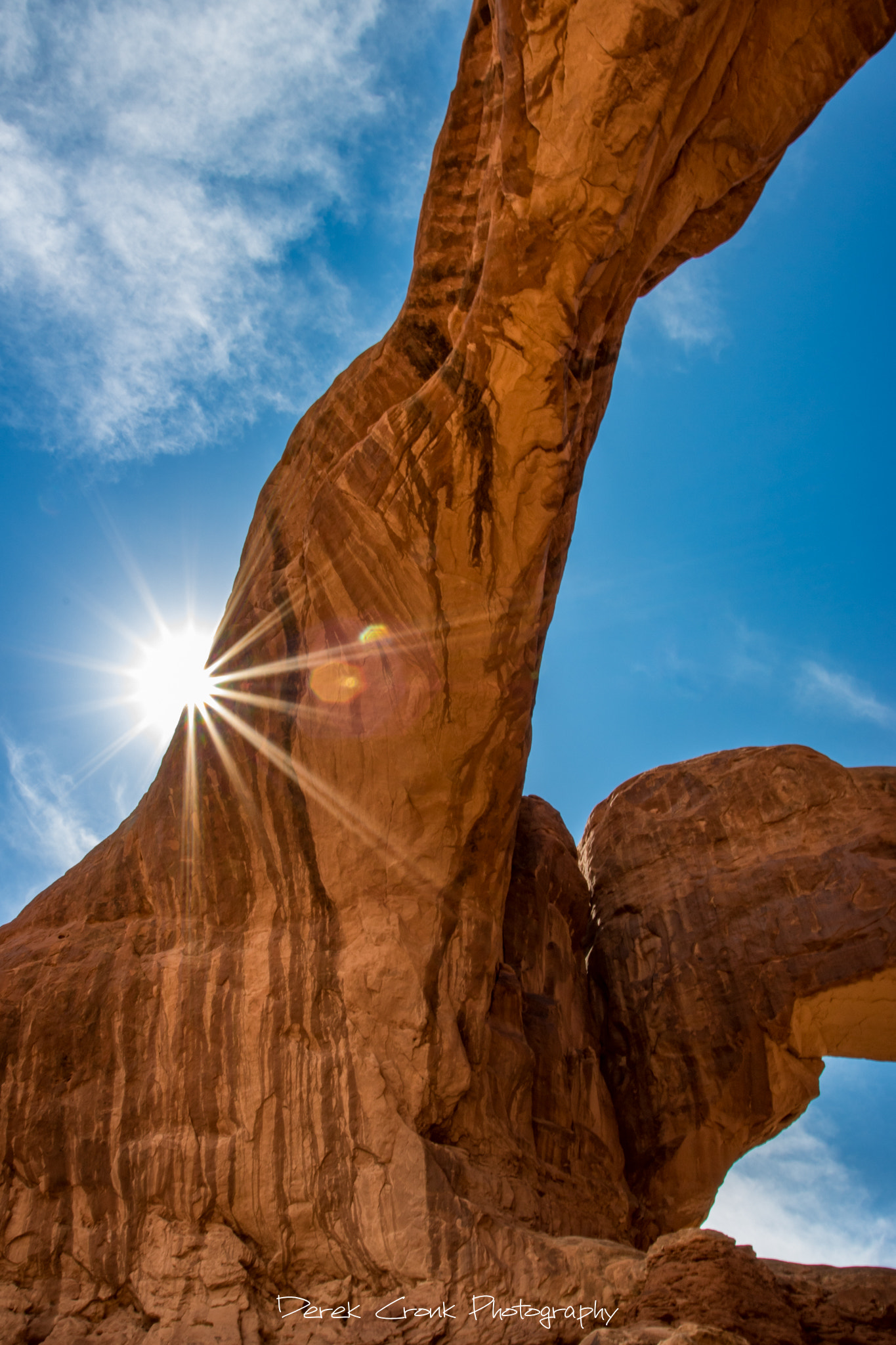 Canon EOS 750D (EOS Rebel T6i / EOS Kiss X8i) + Canon EF 17-40mm F4L USM sample photo. Peeking sun at double arch photography