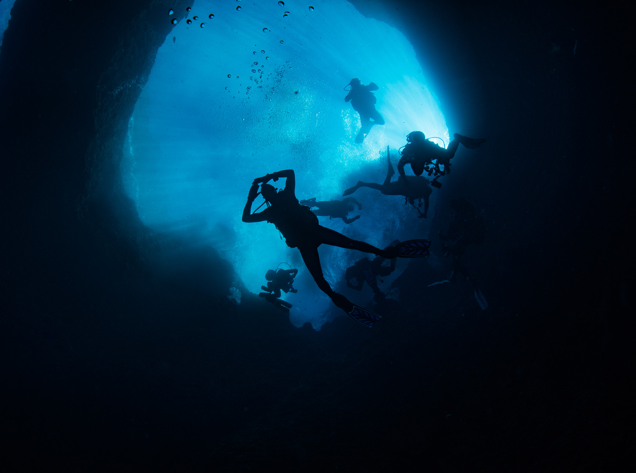 Nikon D750 + Sigma 15mm F2.8 EX DG Diagonal Fisheye sample photo. Divers ascending photography
