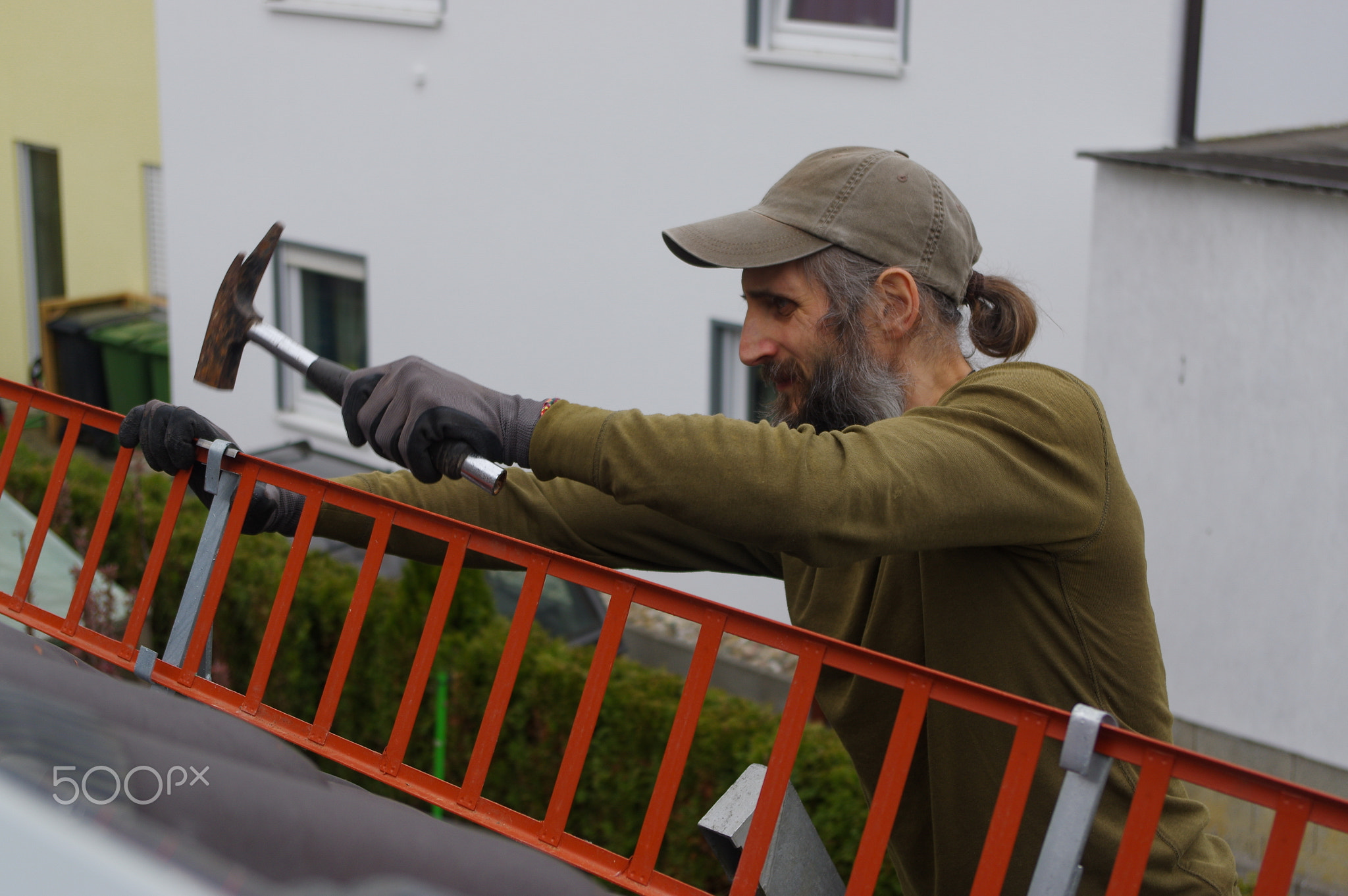 Roofer or a worker repaired on the roof  snow guard grating