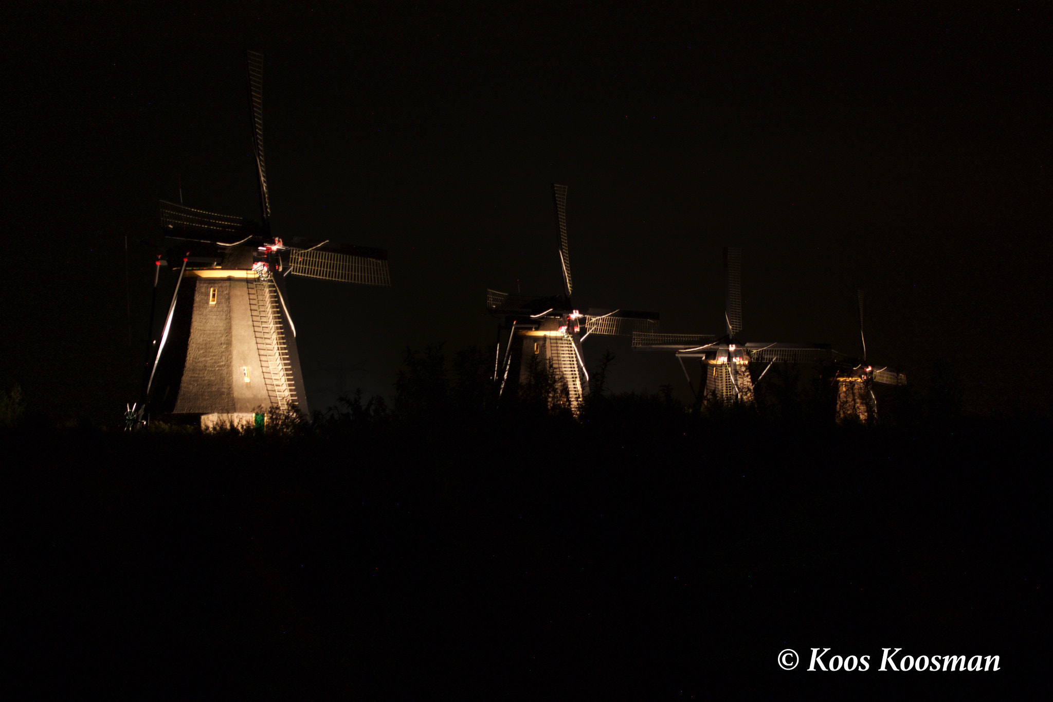 Canon EF 100-400mm F4.5-5.6L IS USM sample photo. Windmills in the dark photography