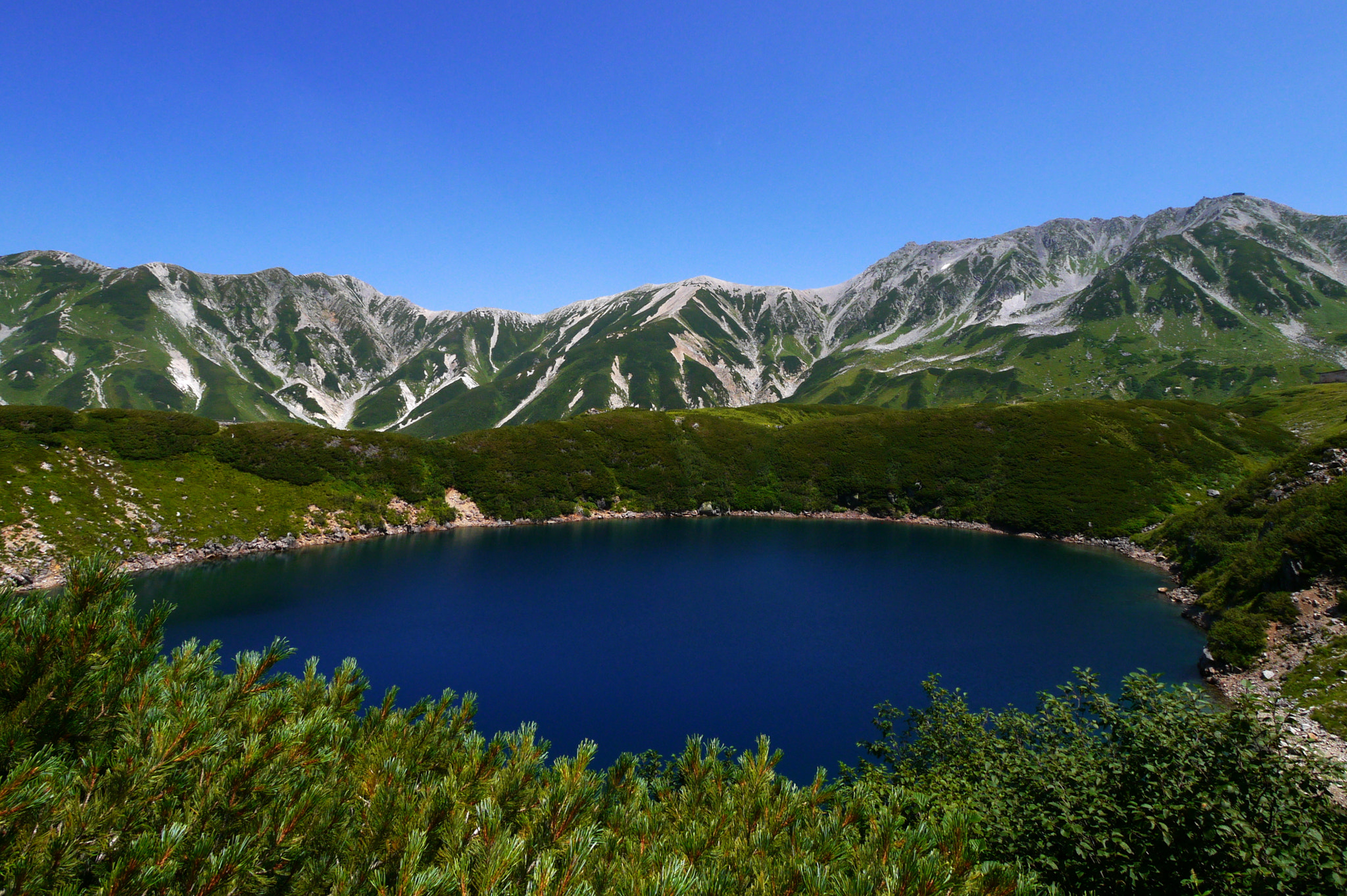 Panasonic Lumix DMC-GX1 + Panasonic Lumix G Vario 7-14mm F4 ASPH sample photo. A pond in the mountains photography