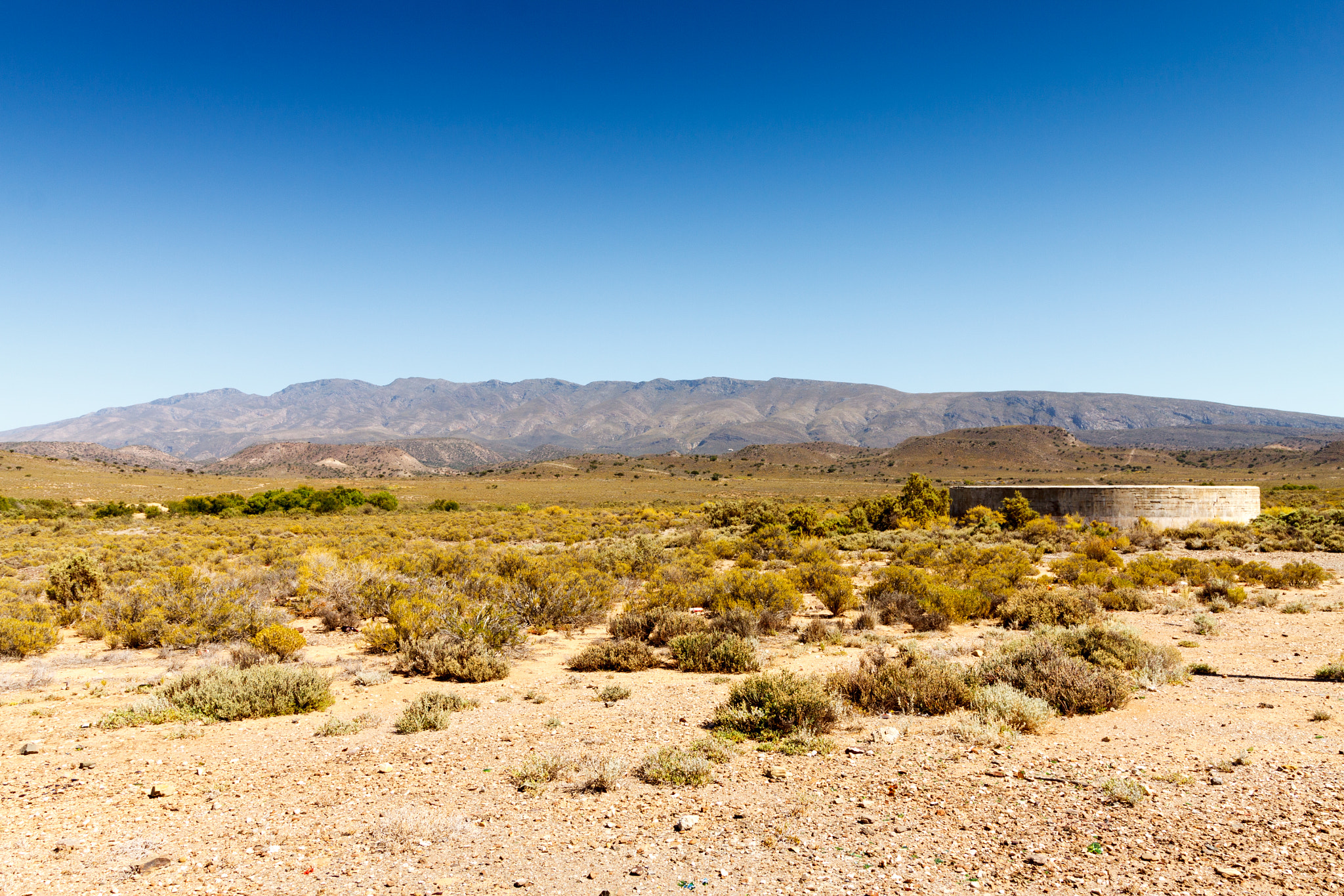 Canon EOS 50D sample photo. Landscape with a dam in the foreground. photography