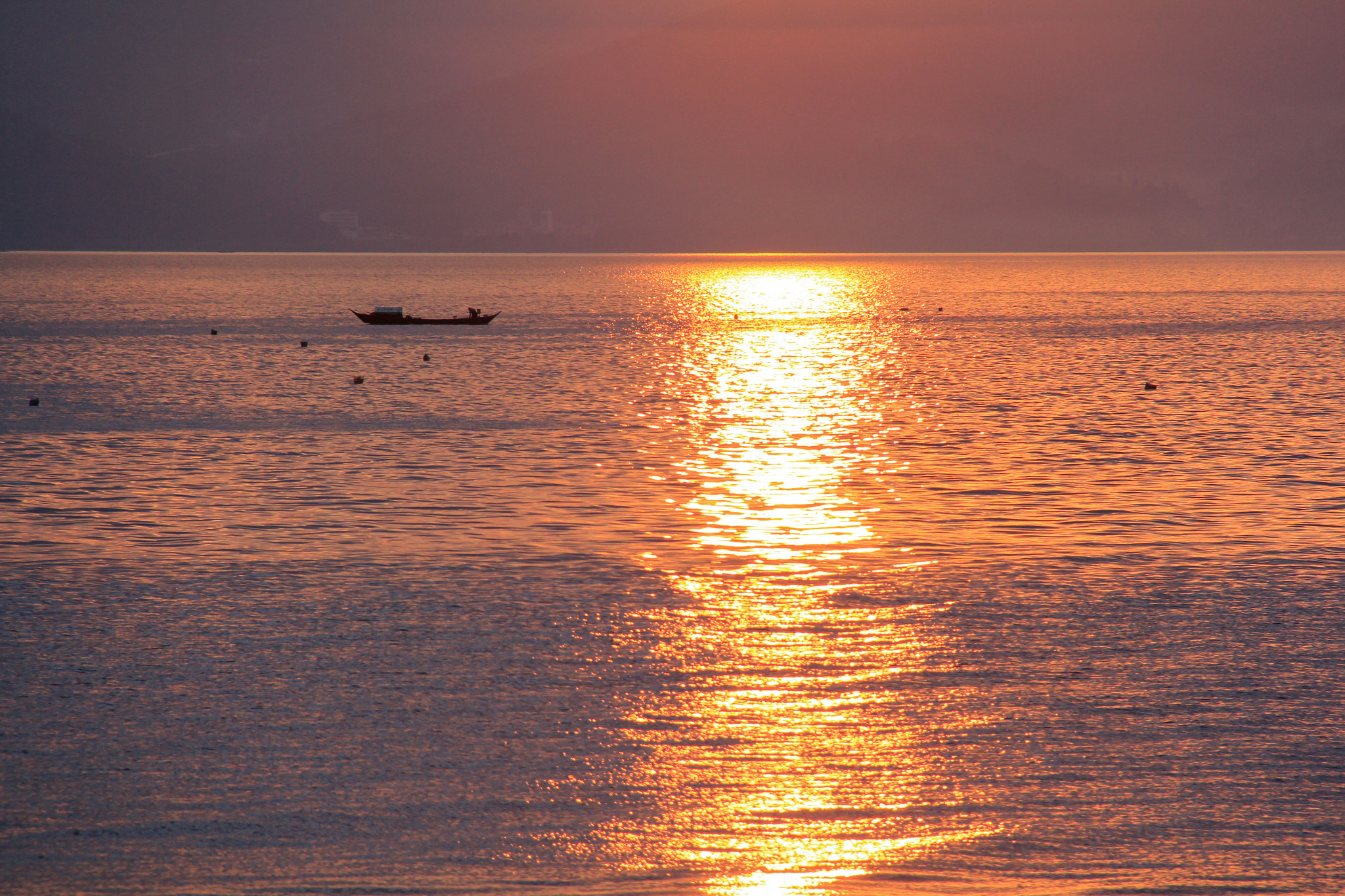 Canon EOS 60D + Canon EF-S 18-200mm F3.5-5.6 IS sample photo. Sunset over the fuxian lake,china. photography