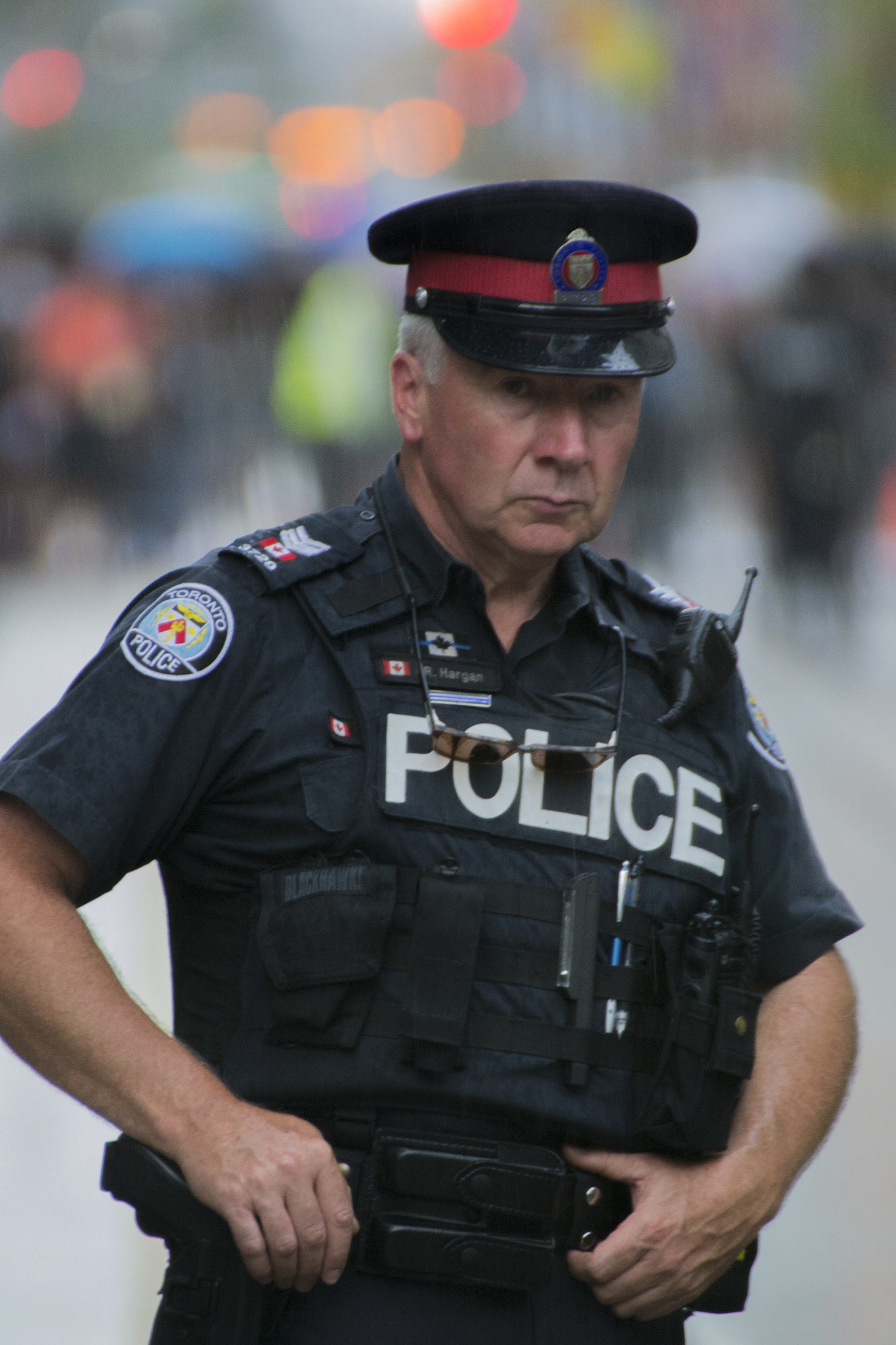 Nikon D3100 + Sigma 50-500mm F4.5-6.3 DG OS HSM sample photo. Toronto police - under the rain photography