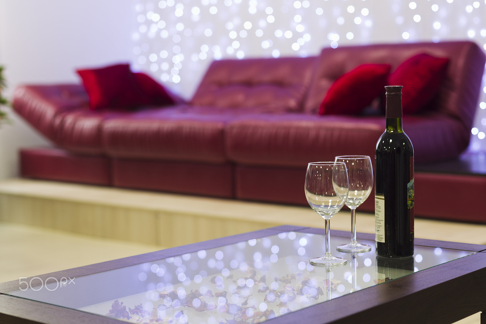 Canon EOS-1D Mark IV sample photo. Interior with a coffee table, a sofa and a bottle of wine photography