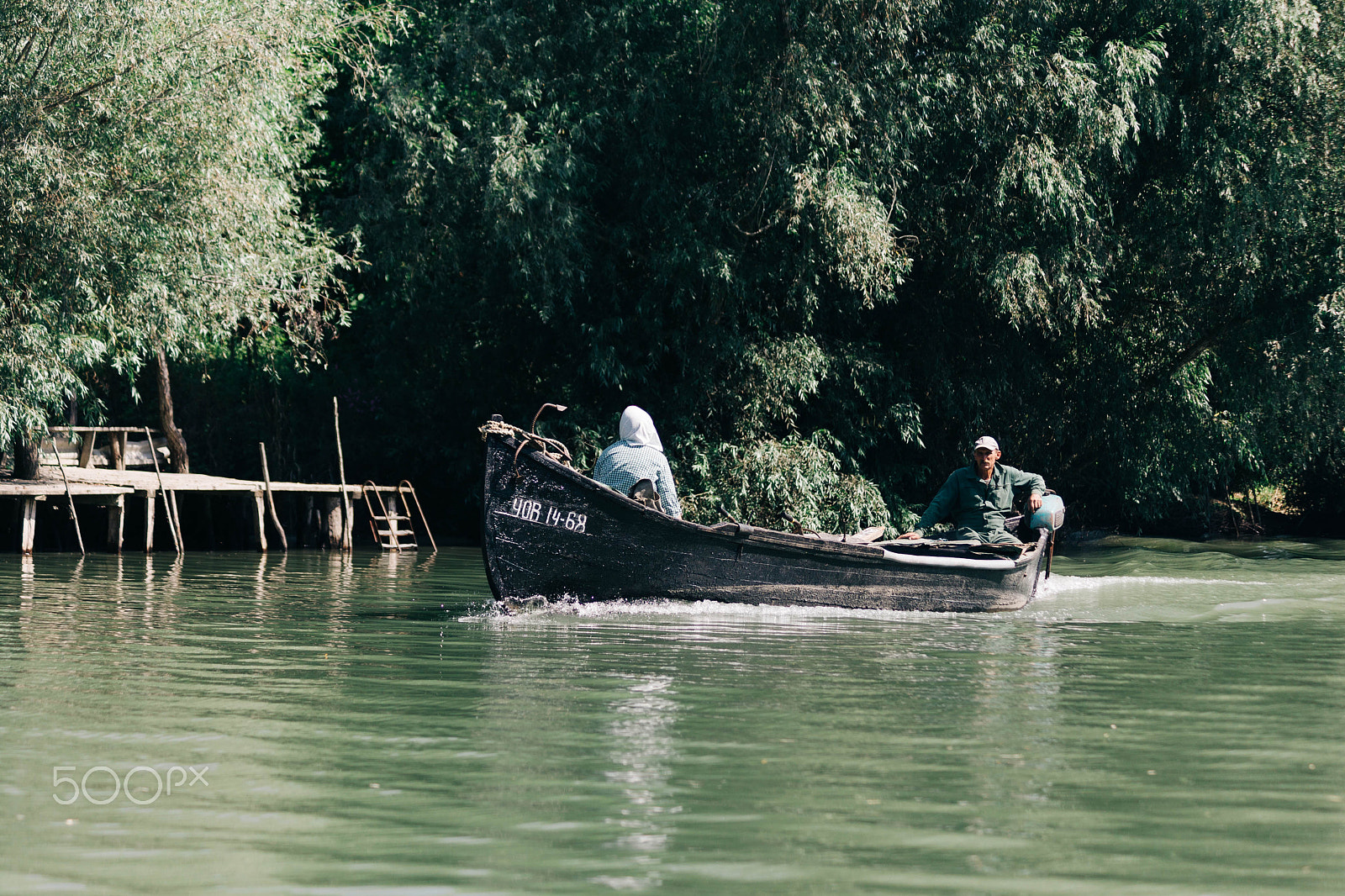 Canon EF 75-300mm F4.0-5.6 IS USM sample photo. Old couple in boat somewhere in ukraine photography