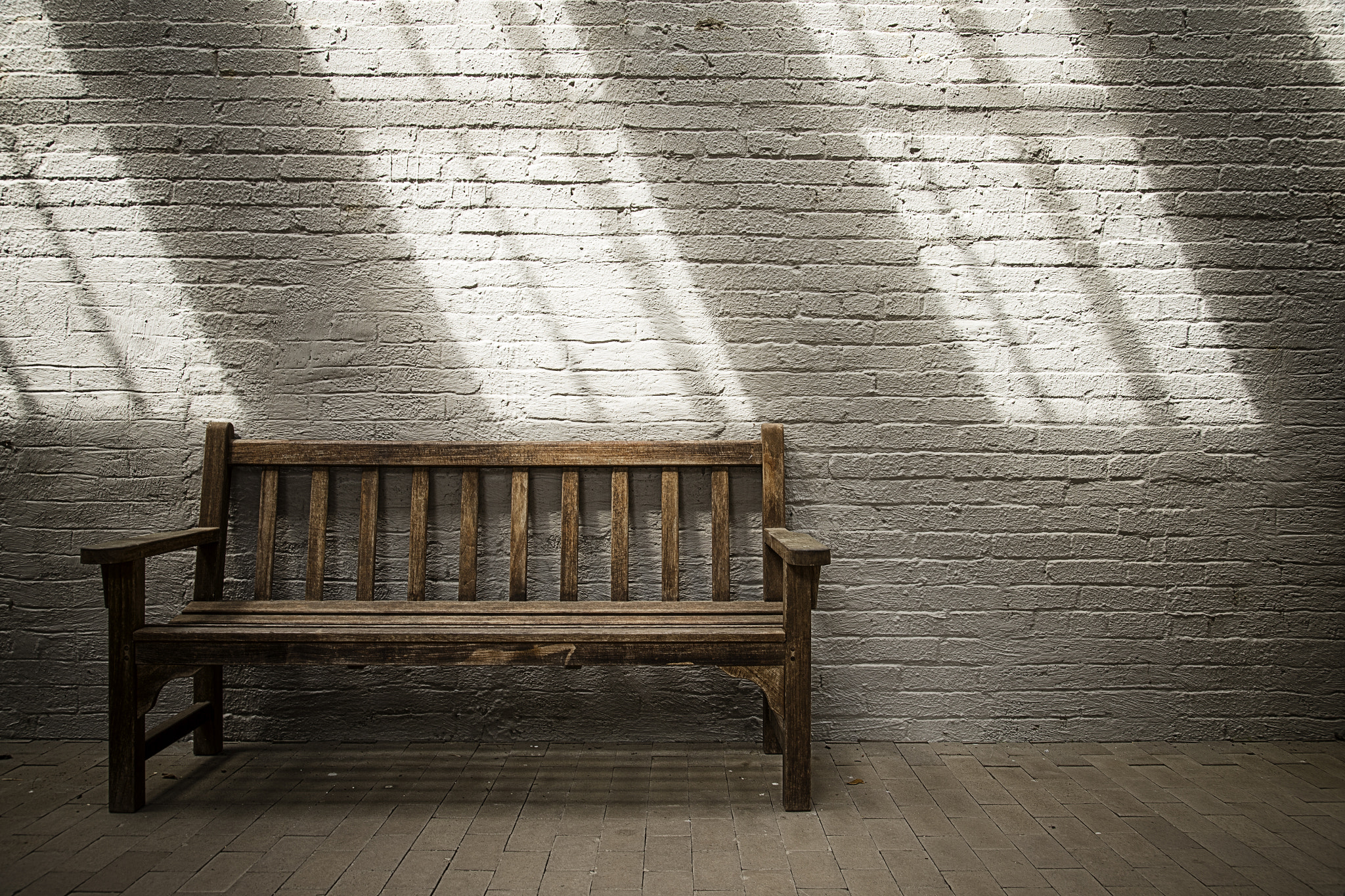 Wooden Bench in the Shadows