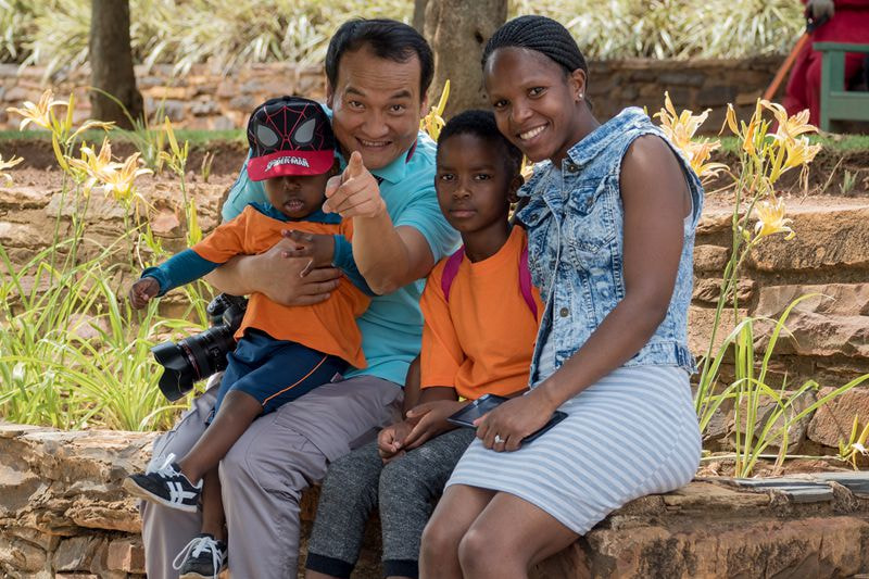 OLYMPUS M.75-300mm F4.8-6.7 sample photo. A chinese man in south africa photography