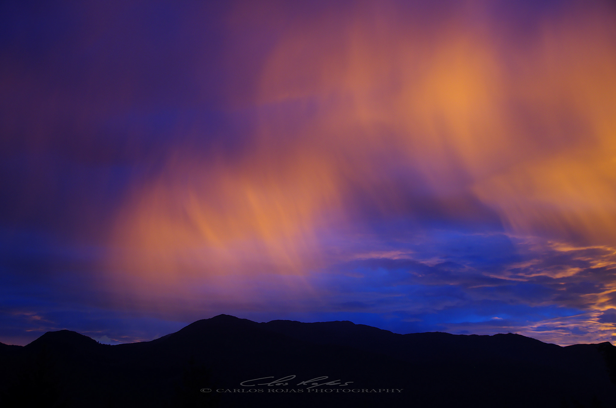 Pentax K-5 sample photo. Rain clouds at sunset photography