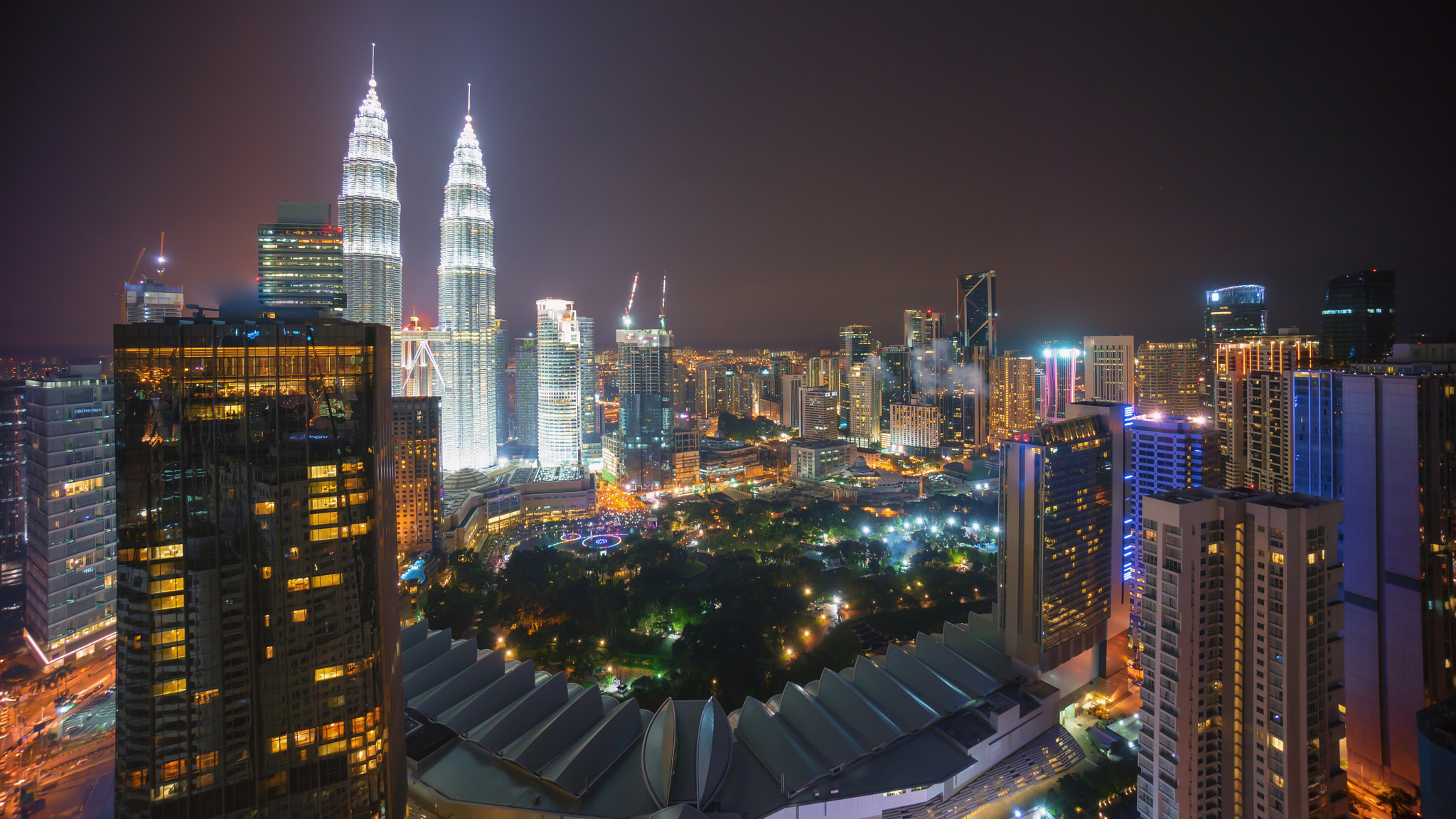 Sony a7R + Sony E 10-18mm F4 OSS sample photo. Kuala lumpur city skyline at night. aerial view. photography