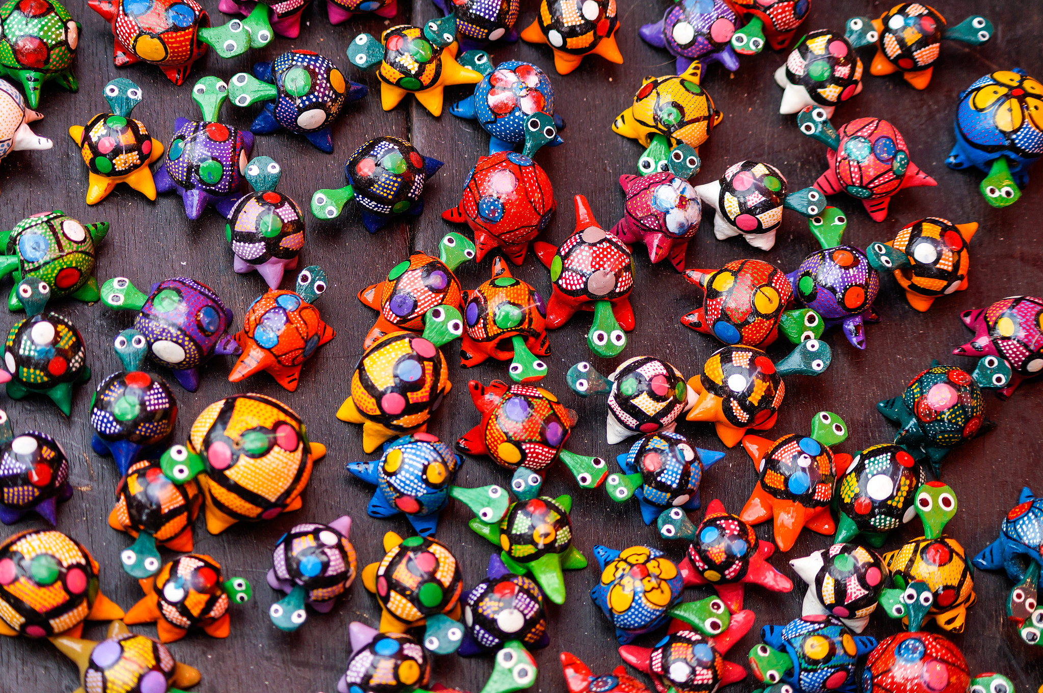Sony SLT-A57 sample photo. Wooden miniature handcrafted turtles on an african market photography