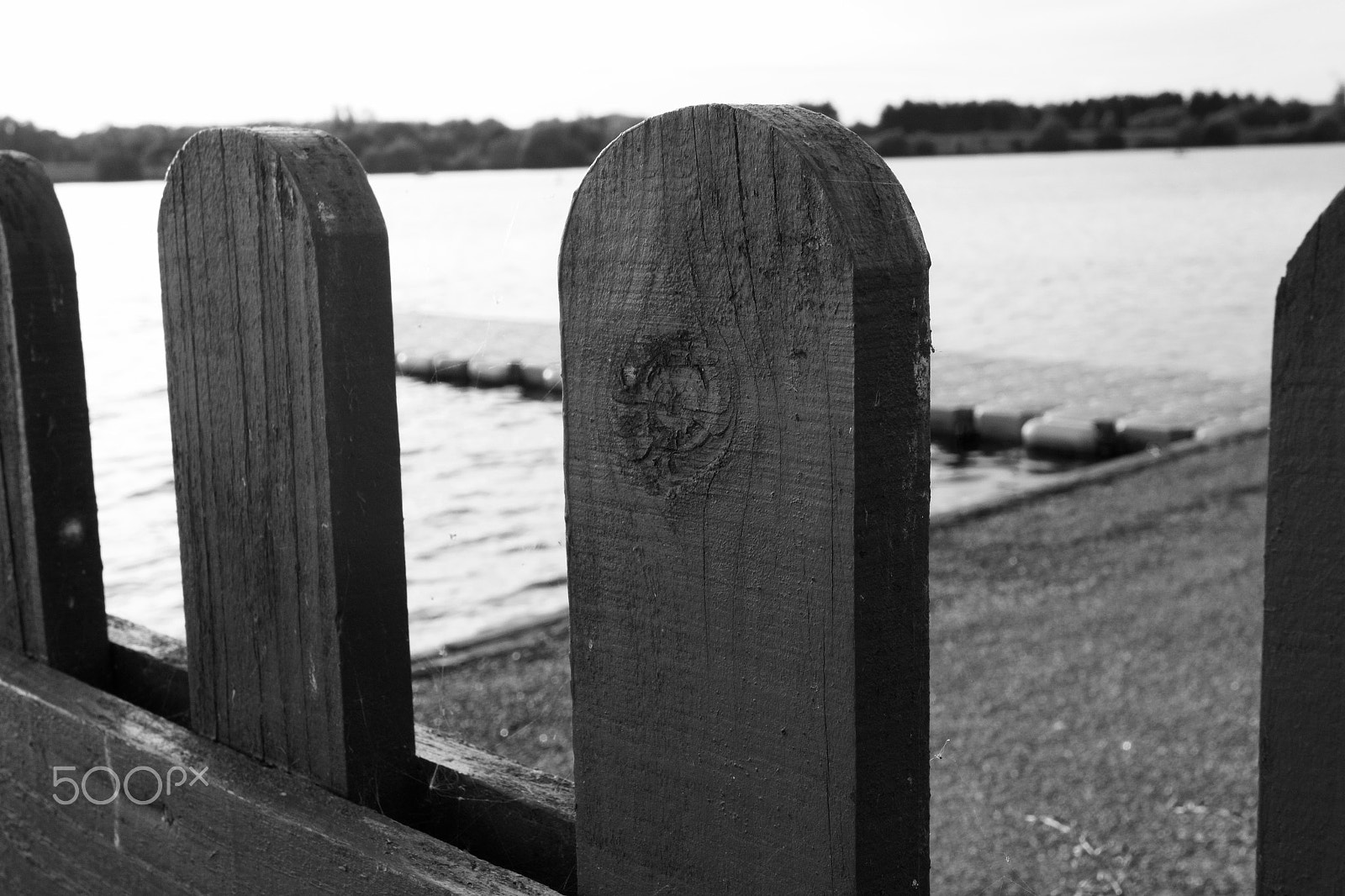 Canon EF-M 28mm F3.5 Macro IS STM sample photo. Lake through fence photography