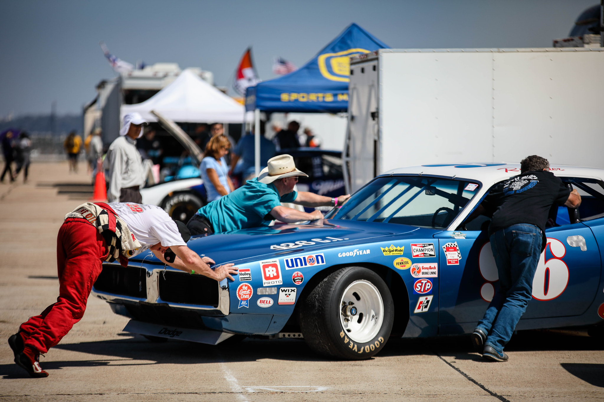 Sigma 70-200mm F2.8 EX DG OS HSM sample photo. Pushing her back into the pits photography