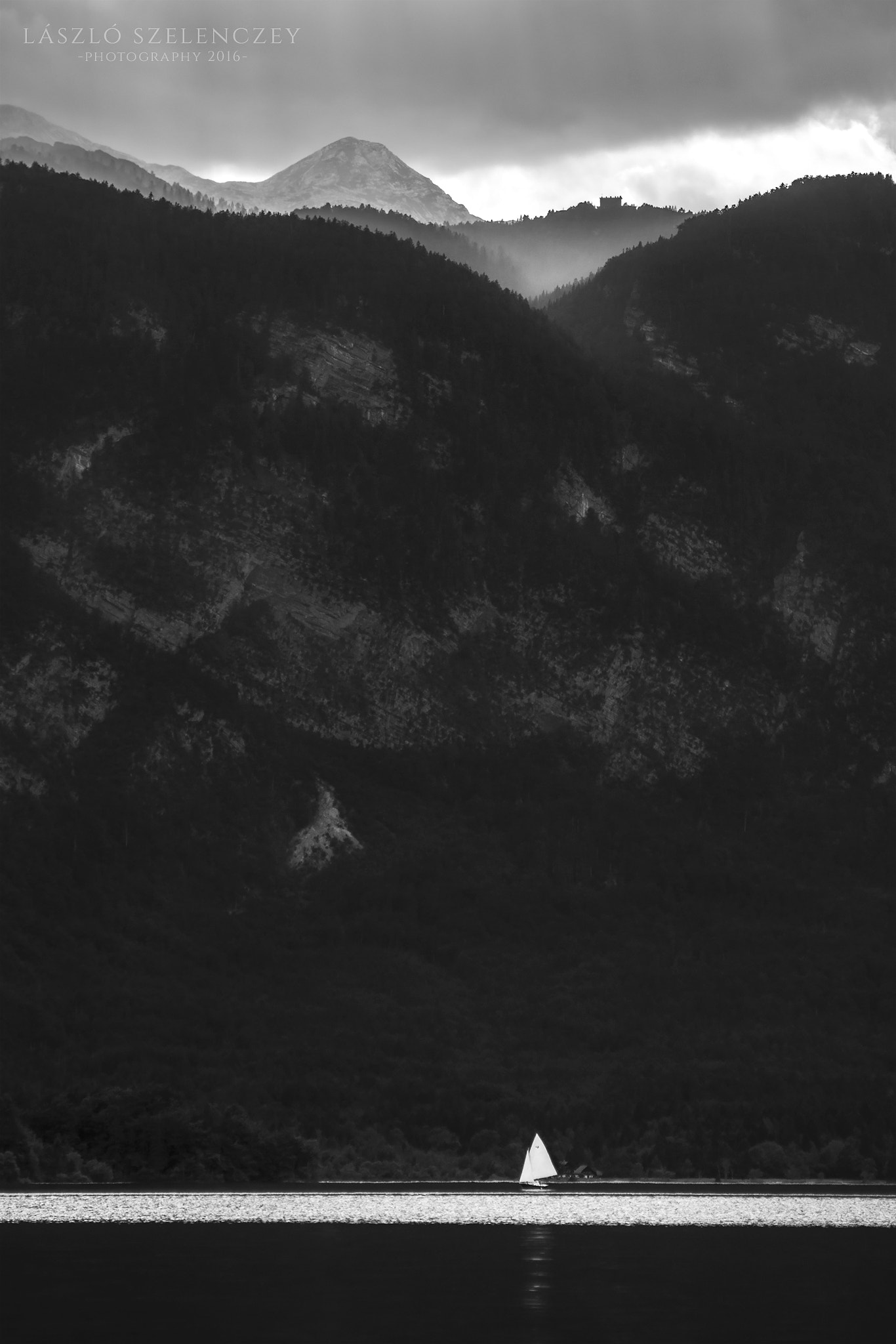 Tamron AF 80-210mm F4-5.6 (178D) sample photo. Sailboat in the shadow of the mountains photography