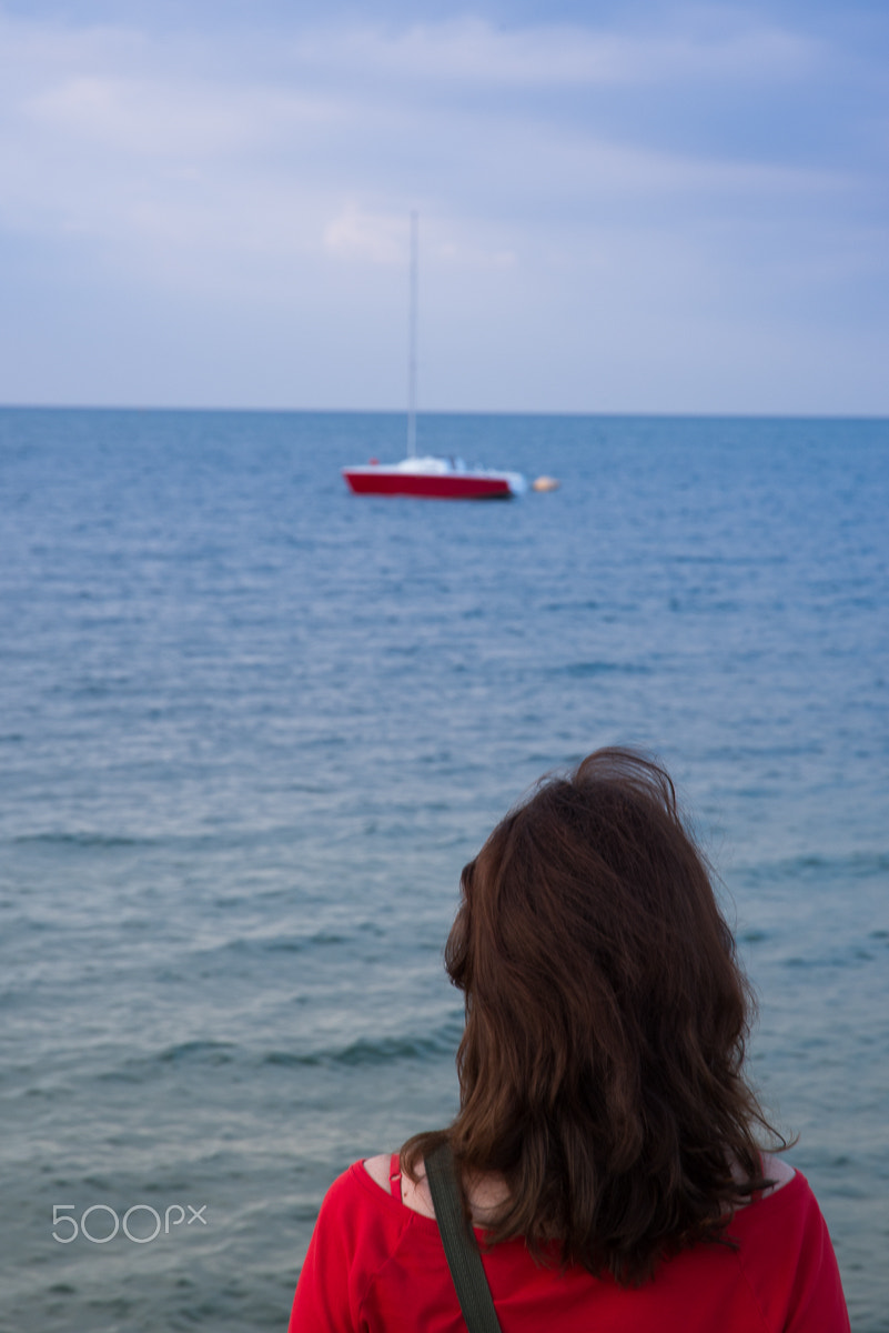 Nikon D610 + Nikon AF-S Nikkor 24-120mm F3.5-5.6G ED-IF VR sample photo. Woman in red seeing red boat photography