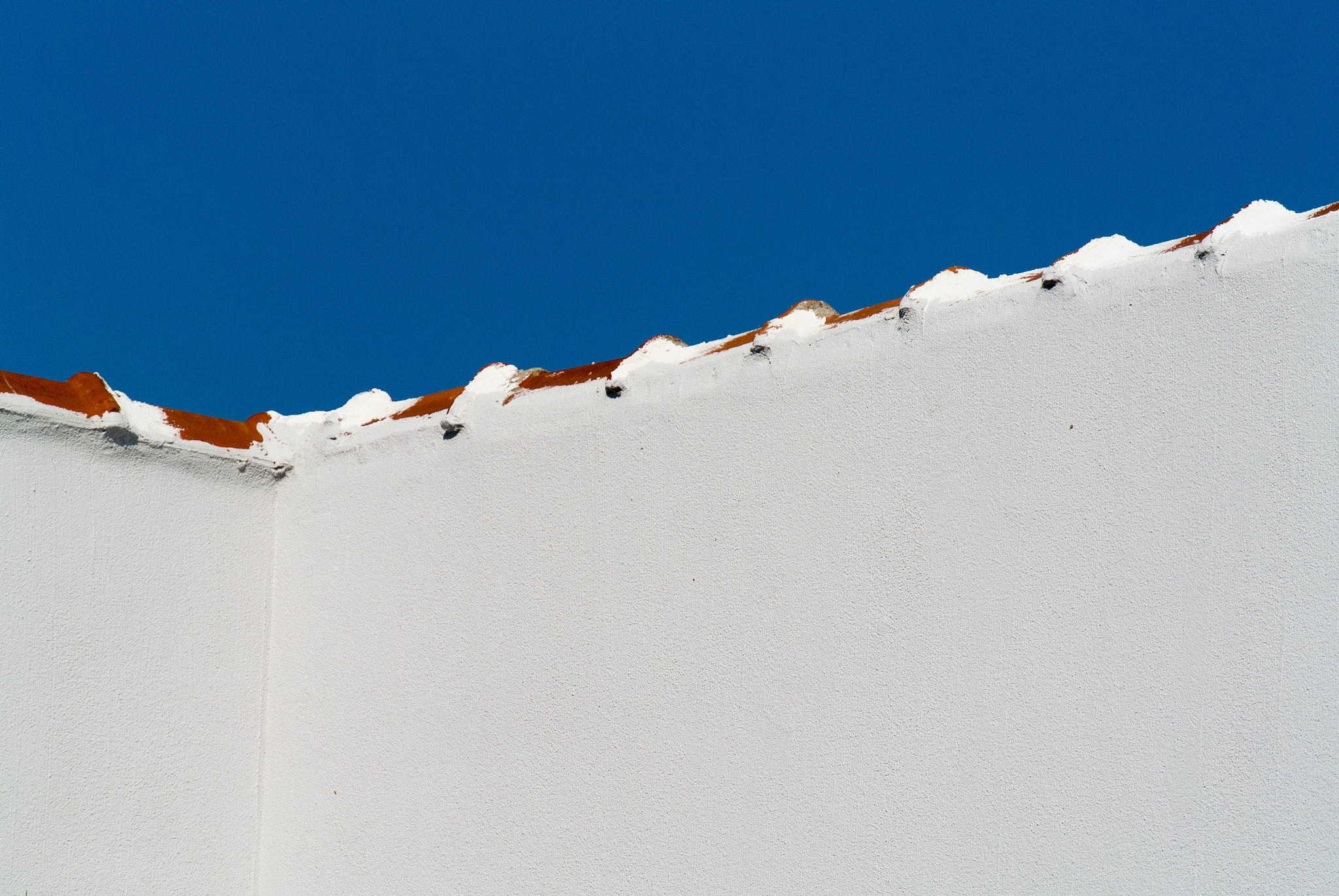 Nikon 1 Nikkor VR 30-110mm F3.8-5.6 sample photo. Border between roof and sky photography