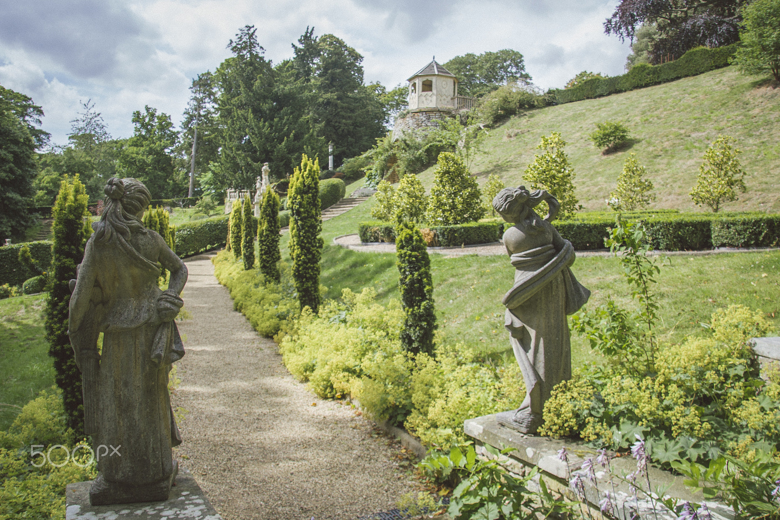 Canon EF-S 17-85mm F4-5.6 IS USM sample photo. Statues overlooking garden alleys photography
