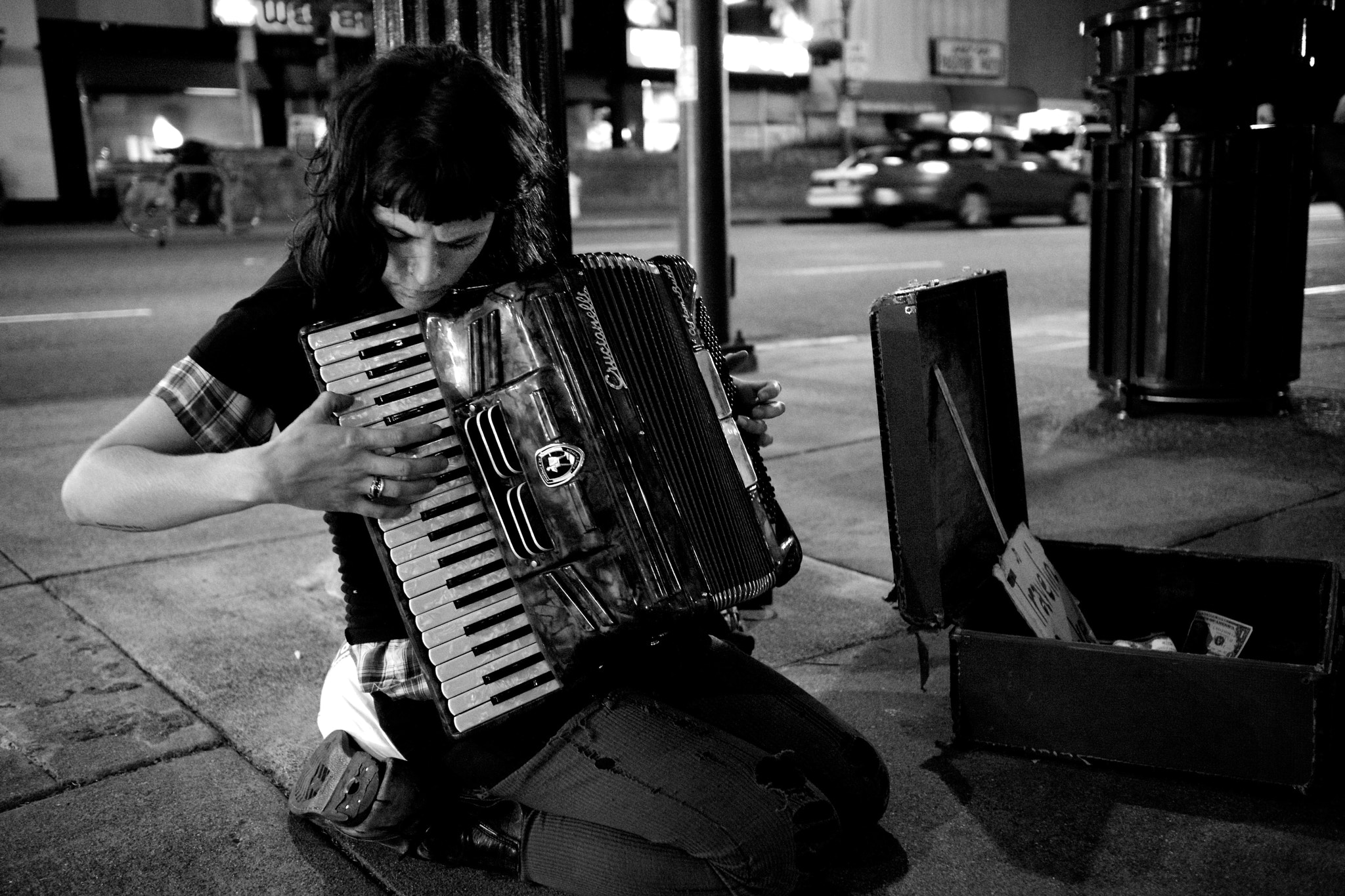 Sony Alpha NEX-7 + Sony Sonnar T* E 24mm F1.8 ZA sample photo. It's generous to drop a buck and walk on by - but stop and listen if you like their music. photography