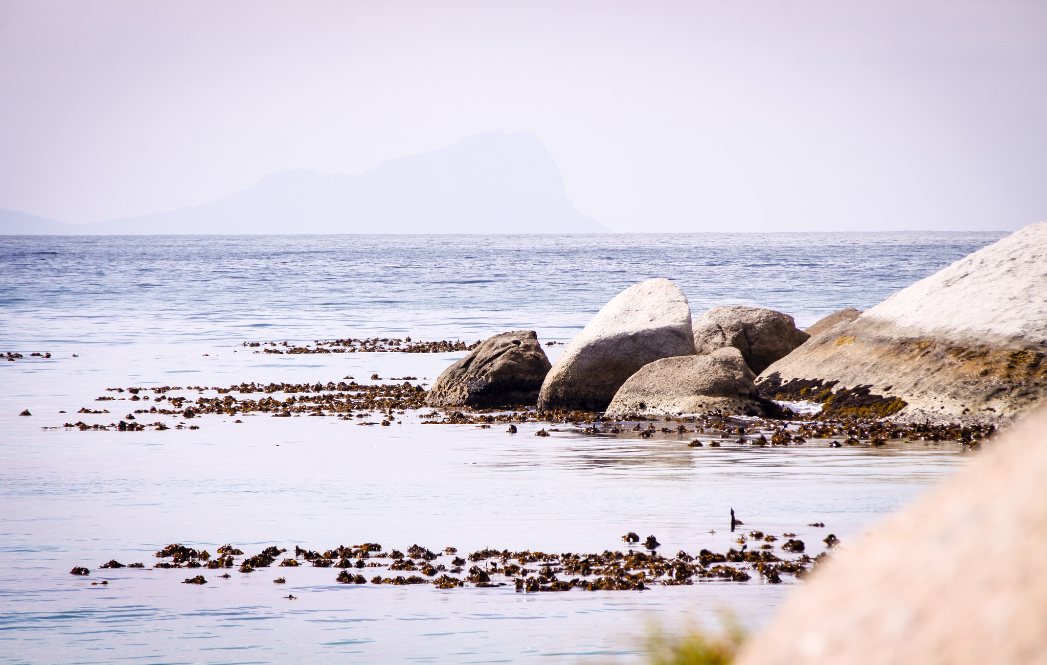 Canon EOS 50D sample photo. Bolders in the ocean photography