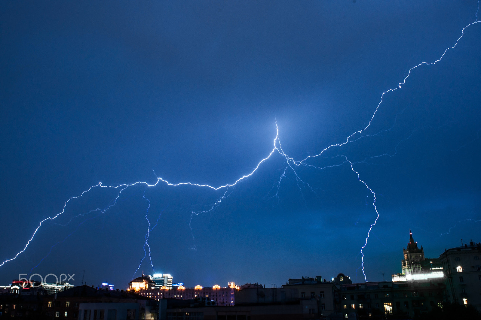 Sony Alpha DSLR-A700 + Sony 20mm F2.8 sample photo. Lightning in city photography